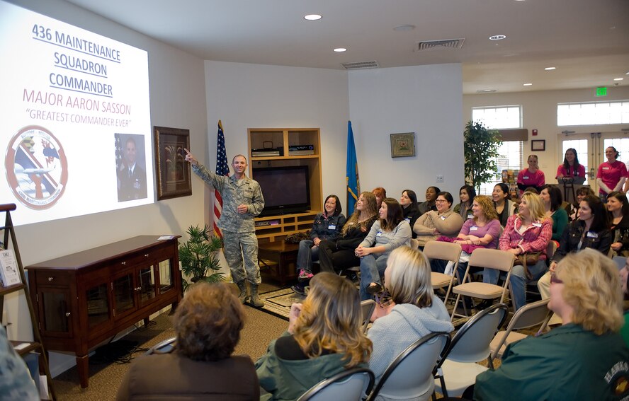 Maj. Aaron Sasson gives the introduction to 436th Maintenance Squadron’s spouse’s commander’s call April 1, 2011, in the Hunt Community Center at Dover Air Force Base, Del. The person who prepared the slide-show surprised Major Sasson and the spouses with the first slide proclaiming him the “greatest commander ever.” (U.S. Air Force photo by Airman 1st Class Jacob Morgan)