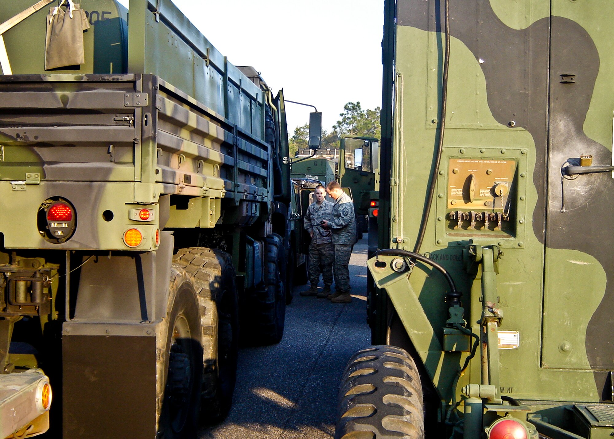 Airmen from the 728th Air Control Squadron check equipment on trucks ready to leave Eglin for a 10-day large scale field training exercise.  (U.S. Air Force photo/Lois Walsh)