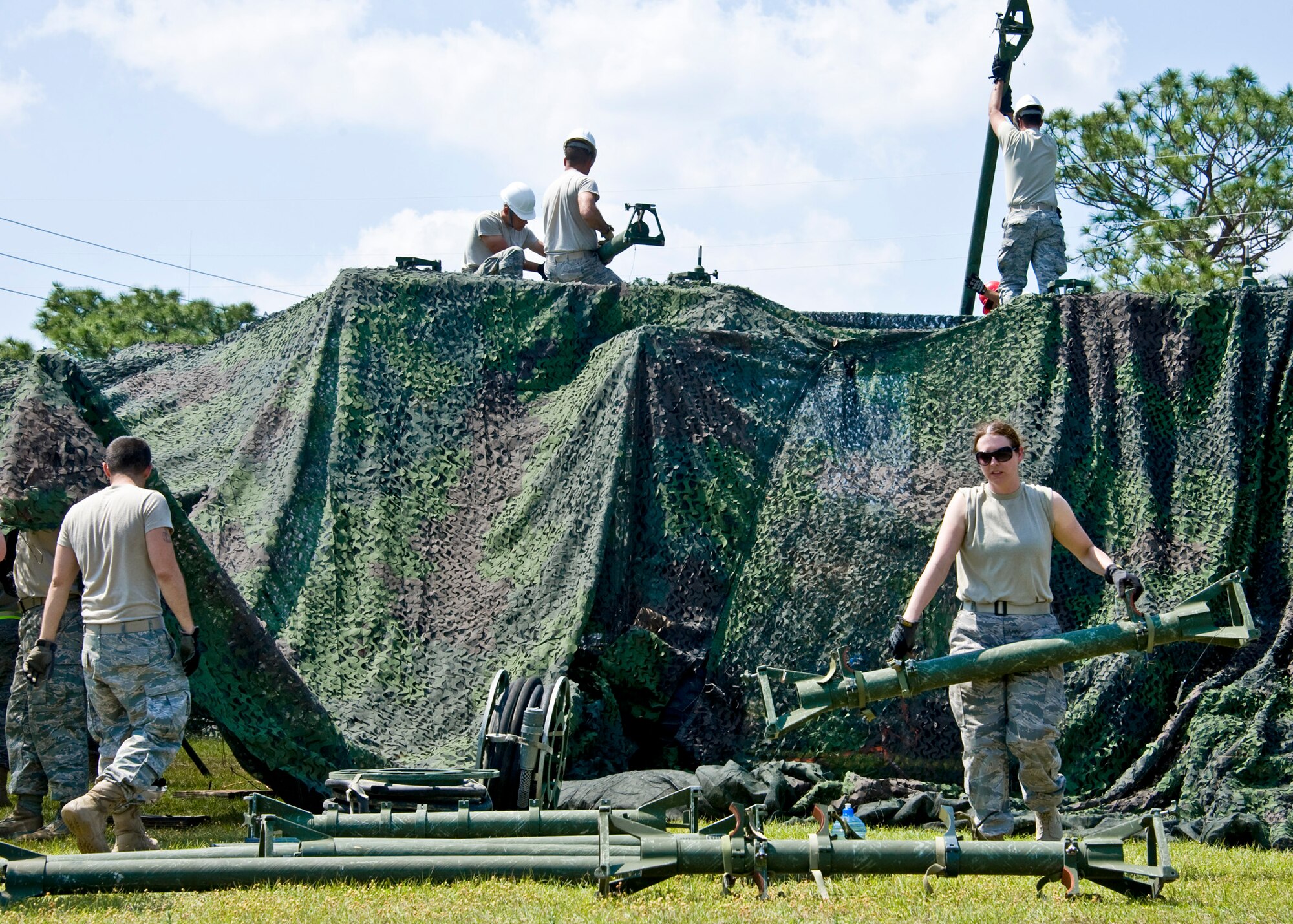 Members of the 728th Air Control Squadron move and stand up VHF and UHF antennae at Duke Field April 1 prior to a 10-day exercise. (U.S. Air Force photo/Tech. Sgt. Samuel King Jr.)