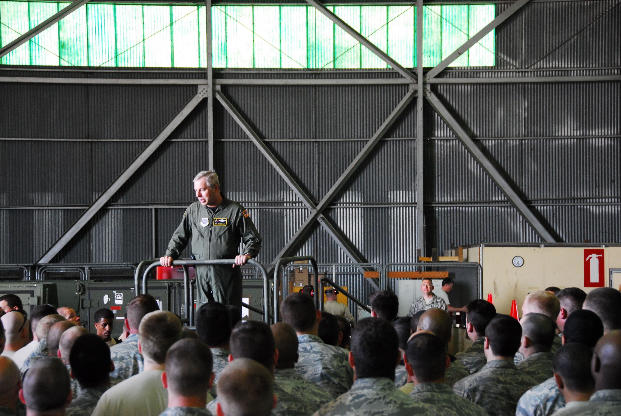 313th AIR EXPEDITIONARY WING (March 30, 2011) -- Brig. Gen. Roy Uptegraff, commander of the 313th AEW, addresses Airmen of the wing's maintenance group. "We have an extraordinary group of ladies and gentlemen. The ability for all of these folks to come together, with no notice or pre-coordination, is impressive," he said. The 313th now supports Operation Unified Protector, a NATO-led mission in Libya to protect civilians and civilian-populated areas under threat of attack. The 313th AEW provides aerial refueling to U.S. and coalition aircraft with KC-135 Stratotankers and KC-10 Extenders. (U.S. Air Force photo by Tech. Sgt. Stacy Gault)