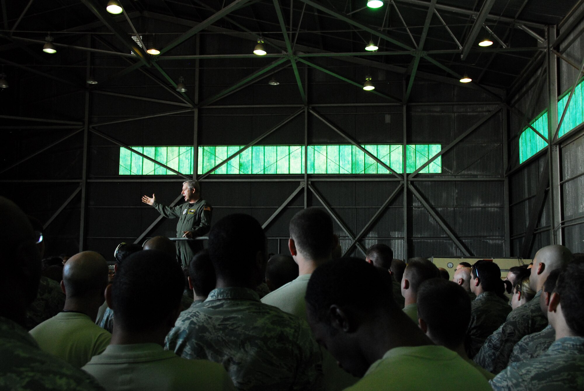 313th AIR EXPEDITIONARY WING (March 30, 2011) -- Brig. Gen. Roy Uptegraff, commander of the 313th AEW, addresses Airmen of the wing's maintenance group. "We have an extraordinary group of ladies and gentlemen. The ability for all of these folks to come together, with no notice or pre-coordination, is impressive," he said. The 313th now supports Operation Unified Protector, a NATO-led mission in Libya to protect civilians and civilian-populated areas under threat of attack. The 313th AEW provides aerial refueling to U.S. and coalition aircraft with KC-135 Stratotankers and KC-10 Extenders. (U.S. Air Force photo by Tech. Sgt. Stacy Gault/Released)