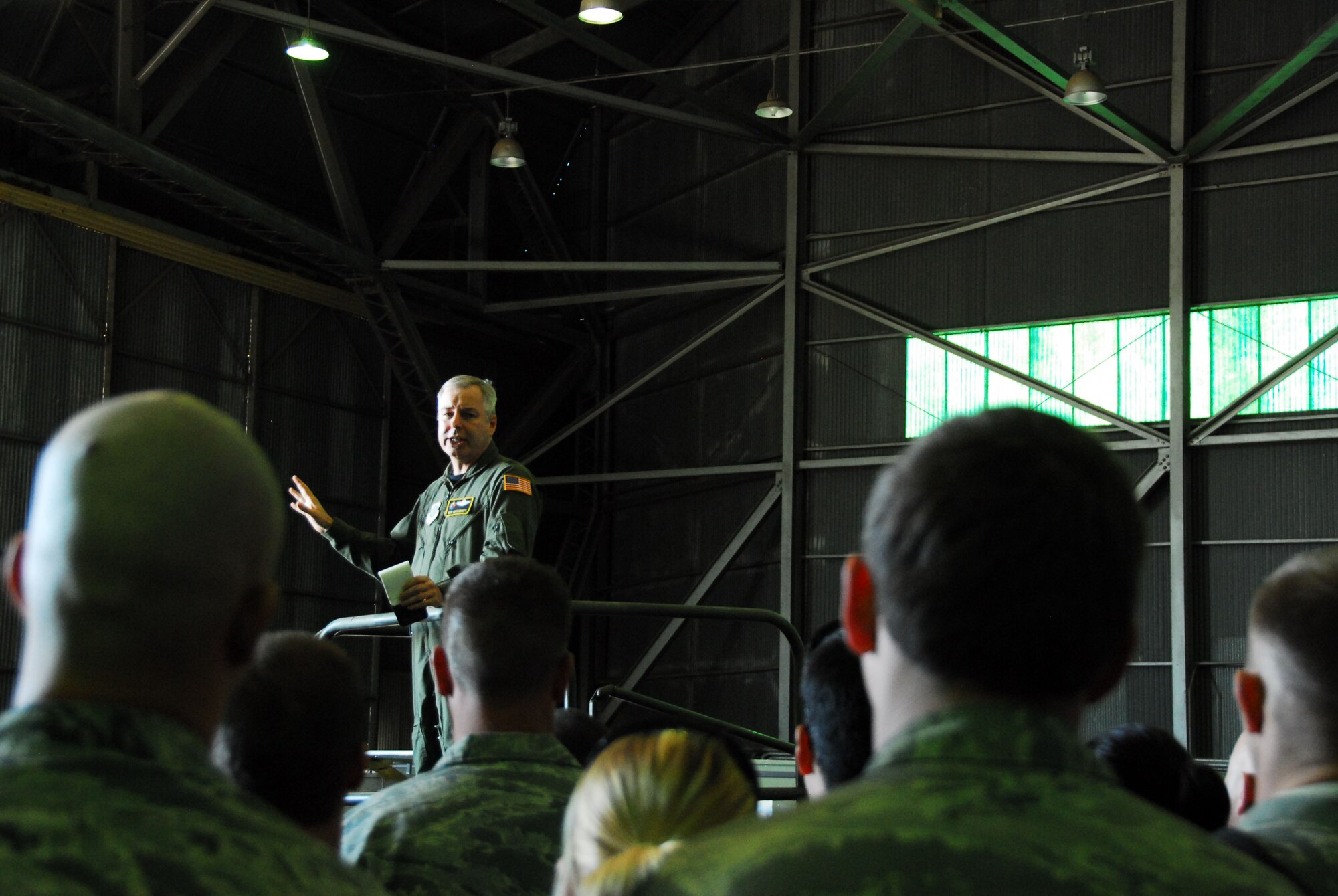313th AIR EXPEDITIONARY WING (March 30, 2011) -- Brig. Gen. Roy Uptegraff, commander of the 313th AEW, addresses Airmen of the wing's maintenance group. "We have an extraordinary group of ladies and gentlemen. The ability for all of these folks to come together, with no notice or pre-coordination, is impressive," Uptegraff said. The 313th now supports Operation Unified Protector, a NATO-led mission in Libya to protect civilians and civilian-populated areas under threat of attack. The 313th AEW provides aerial refueling to U.S. and coalition aircraft with KC-135 Stratotankers and KC-10 Extenders. (U.S. Air Force photo by Tech. Sgt. Stacy Gault)