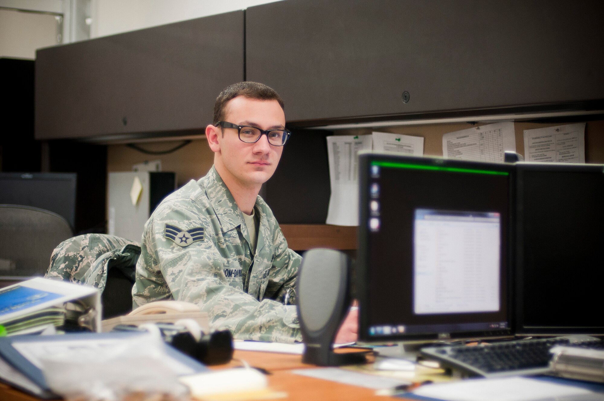 YOKOTA AIR BASE, Japan -- Senior Airman James Odom-Davidson, 374th Maintenance Squadron aircraft fuels systems technician, sits at his desk here April 4, 2011. Airman Odom-Davidson is a native of Salem, Ore. (U.S. Air Force photo/Staff Sgt. Chad C. Strohmeyer)