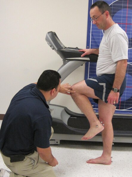 LAUGHLIN AIR FORCE BASE, Texas - - Ray Torres, 47th Medical Operations Squadron exercise physiologist, prepares Major Dwayne Keener, 47th Flying Training Wing chaplain, for a gait analysis at Laughlin’s Health and Wellness Center. (Contributed Photo) 
