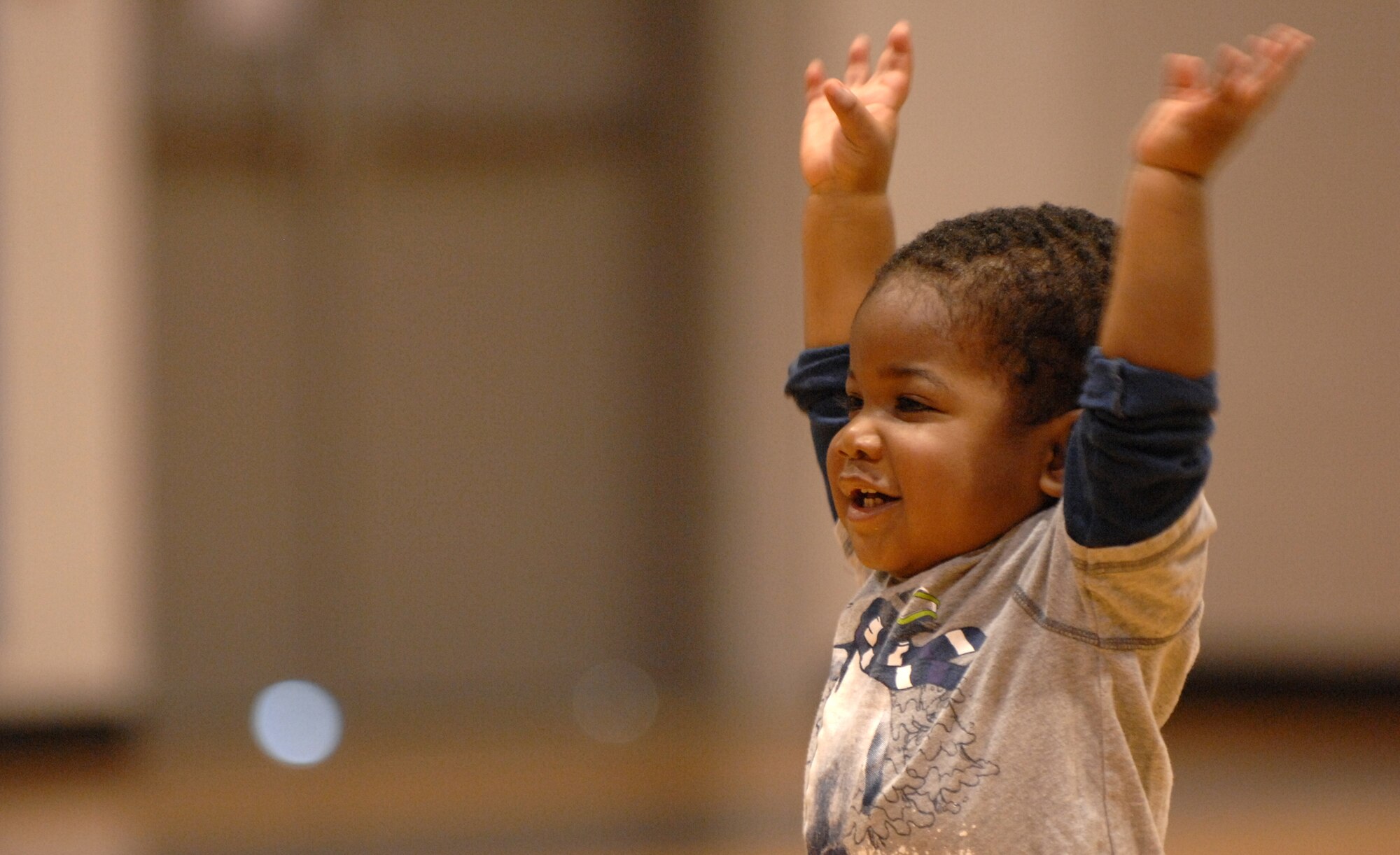 WHITEMAN AIR FORCE BASE, Mo. -- DJ Williams, son of Staff Sergeants Kennecia and Dominique Williams, imitates a Zumba instructor during Family Fitness Day April 2, 2011. The event is held annually to teach parents and children that fitness can be fun and done together. (U.S. Air Force photo by Airman 1st Class Cody H. Ramirez)