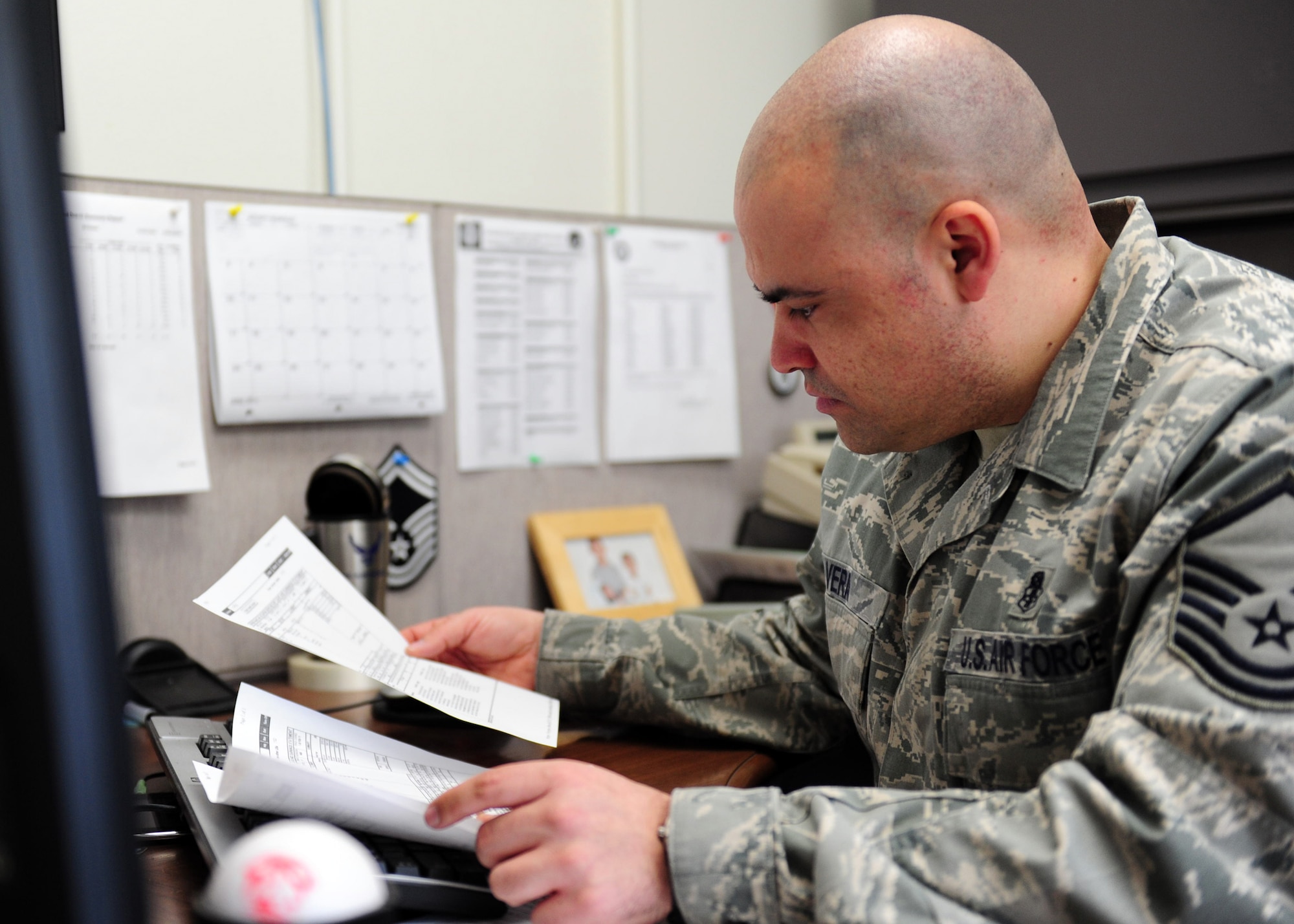 YOKOTA AIR BASE, Japan -- Master Sgt. Eduardo Vera reviews paperwork at the medical logistics flight warehouse, Yokota Air Base, Japan, April 4, 2011. The 374th Medical Support Squadron at Yokota has been working diligently as the medical hub after the recent earthquake and tsunami struck Japan. Sergeant Vera is assigned to the 374th MDSS as the medical logistical NCO in charge. (U.S. Air Force photo/Senior Airman Michael J. Veloz)