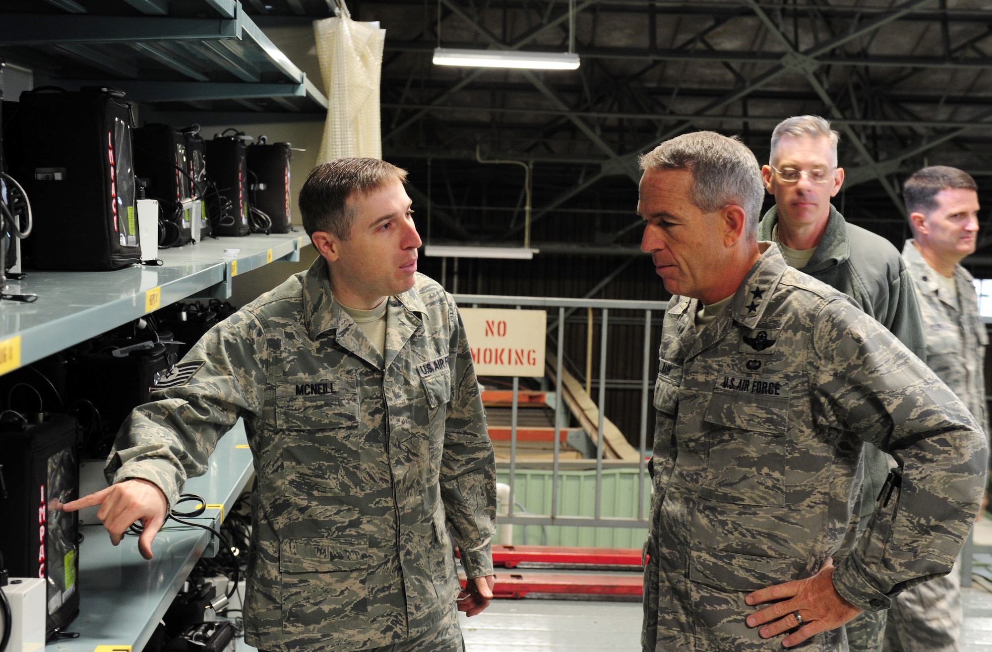 YOKOTA AIR BASE, Japan -- Tech. Sgt. Robert McNeill (left) briefs Maj. Gen. Brooks Bash during a tour of the medical logistics flight warehouse, Yokota Air Base, Japan, April 4, 2011. General Bash visited Yokota after the recent earthquake and tsunami that struck Japan.  General Bash is the vice commander of Pacific Air Forces and Sergeant McNeill is assigned to the 374th Medical Support Squadron as the NCO in charge patient movement items center. (U.S. Air Force photo/Senior Airman Michael J. Veloz)