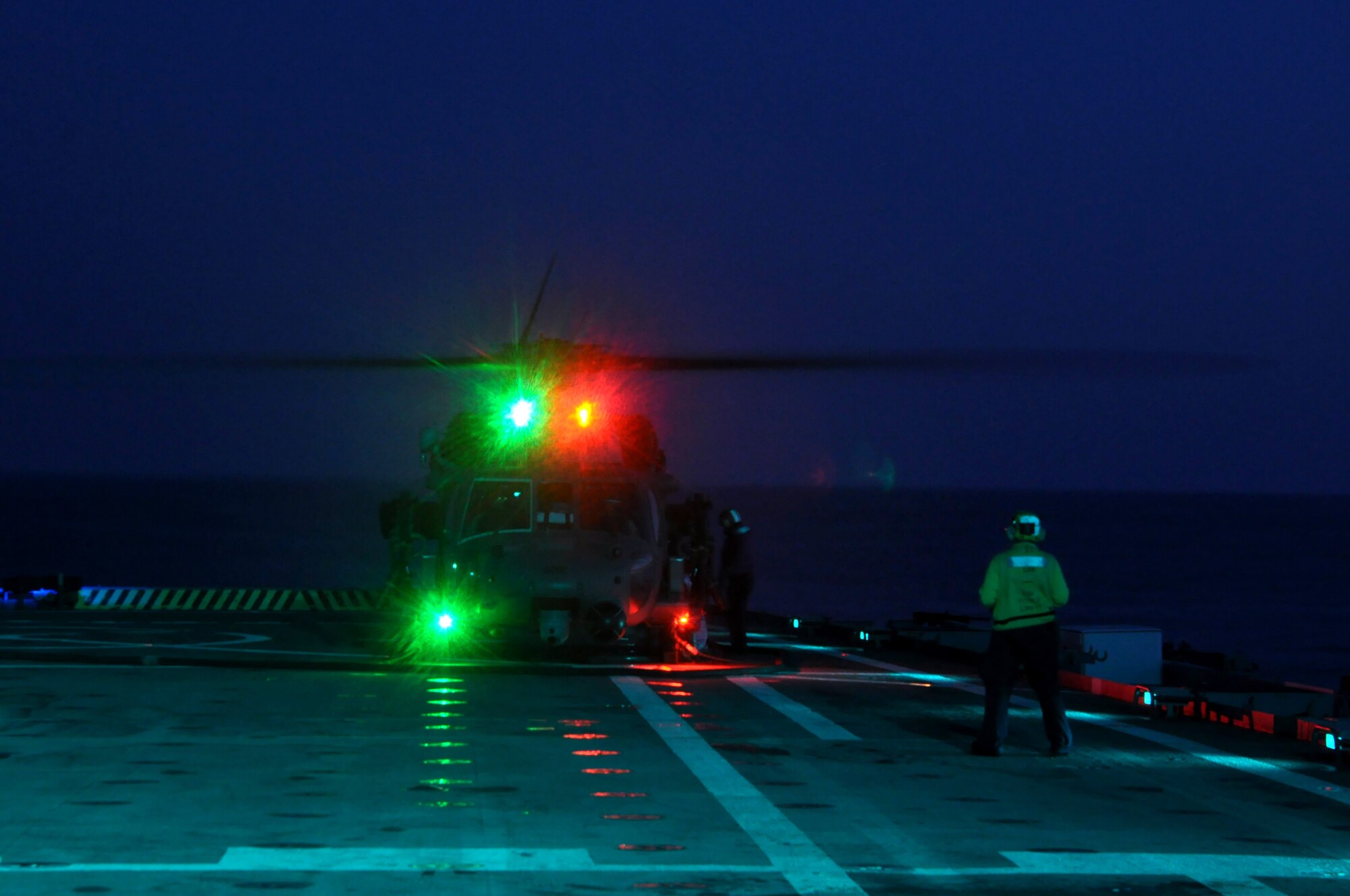 MEDITERRANEAN SEA - Aviation Boatswain’s Mate (Handler) 2nd Class Matthew Kolb observes the refueling of a U.S. Air Force HH-60G Pave Hawk from the 56th Rescue Squadron as it prepares to take off from amphibious transport dock USS Ponce (LPD 15) during evening training operations on March 25, 2011. Elements of the 56th Rescue Squadron, which is based out of RAF Lakenheath, England, embarked aboard Ponce to provide search and rescue coverage for pilots enforcing the no-fly zone over Libya. Ponce is part of Kearsarge Amphibious Ready Group, supporting maritime security operations and theater security cooperation efforts in the U.S. 6th Fleet area of responsibility. (U.S. Navy photo by Mass Communication Specialist 1st Class Nathanael Miller)