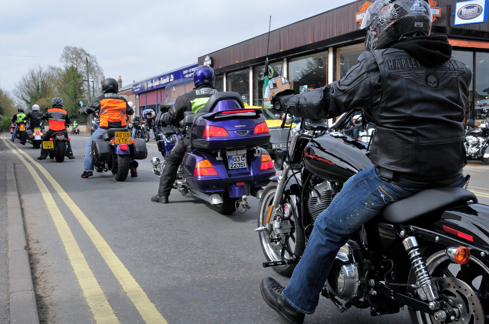 Motorcycle operators stop in front of Black Bear Harley-Davidson shop during their ride through Newmarket, England, after attending a mandatory pre-season motorcycle brief at the RAF Lakenheath Strike Eagle Complex on April 1, 2011.  (U.S. Air Force photo/Staff Sgt. Connor Estes)