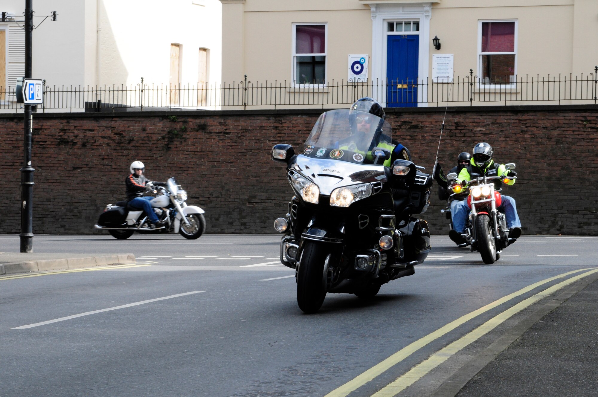 Motorcycle operators ride through Newmarket, England, after attending a mandatory pre-season motorcycle brief at the RAF Lakenheath Strike Eagle Complex on April 1, 2011.  More than 300 riders gathered at the briefing, and many safety issues and requirements were discussed.  Riders were reminded to use risk management by performing thorough route planning, proper safety checks and to wear the correct protective equipment.  The brief was followed by a ride through Stanton, Bury St. Edmunds and Newmarket; and ended at Defender Park on RAF Lakenheath.  (U.S. Air Force photo/Staff Sgt. Connor Estes)