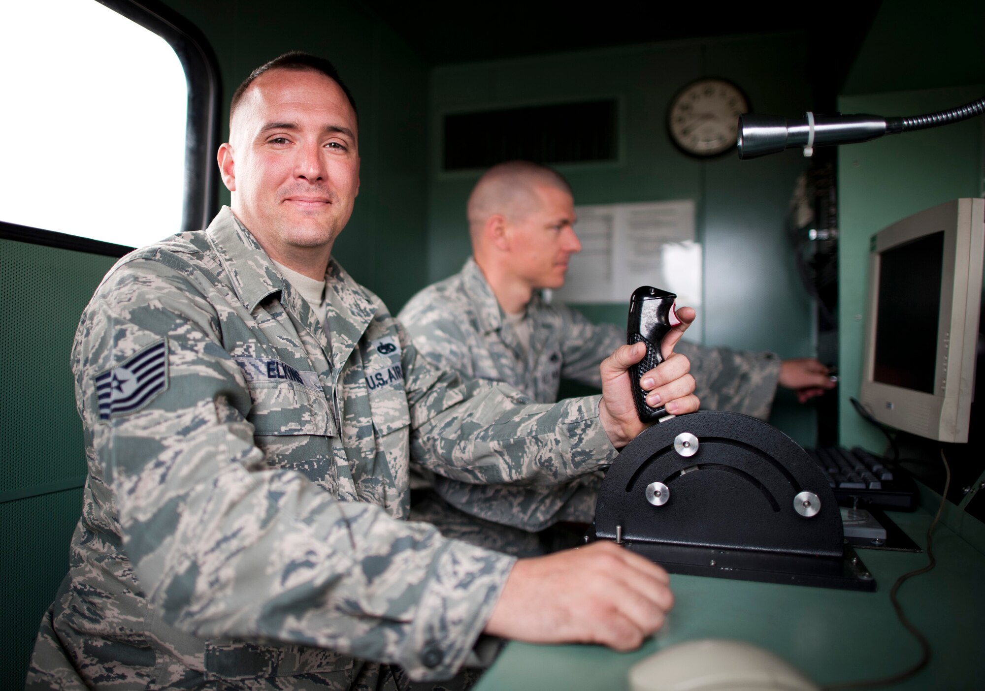 YOKOTA AIR BASE, Japan -- Tech. Sgt. William Elkins, 374th Maintenance Squadron C-130 test cell NCO in charge, smiles for a photo in the C-130 test cell control room, Yokota Air Base, Japan, April 3, 2011. Sergeant Elkins tests and certifies spare engines to support C-130 flights carrying supplies for Operation Tomodachi. "I feel very honored to be able to help the great country of Japan in their time of need, because the Japanese have always treated my family very well." (U.S. Air Force photo/Staff Sgt. Samuel Morse)