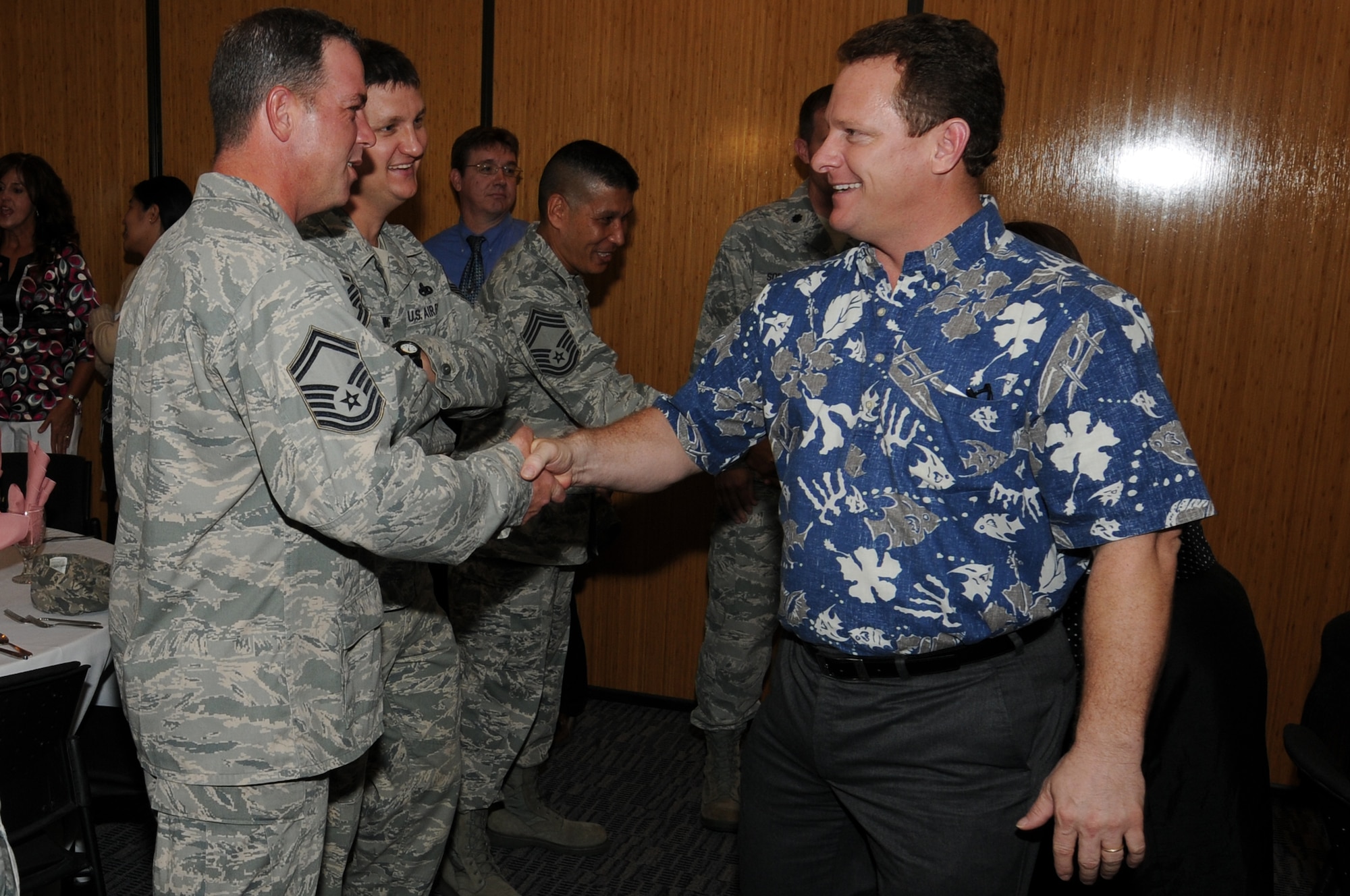 ANDERSEN AIR FORCE BASE, Guam - Lt. Gov. Ray Tenorio of Guam, shakes hands with representatives from the 36th Wing Inspection Group during his visit with his wife, Attorney Naoko Shimizu, to the Women?s History Month Luncheon here, April 5. Lt Gov. Tenorio came to meet the base community and support his wife during her speech.(U.S. Air Force photo/Senior Airman Carlin Leslie)
