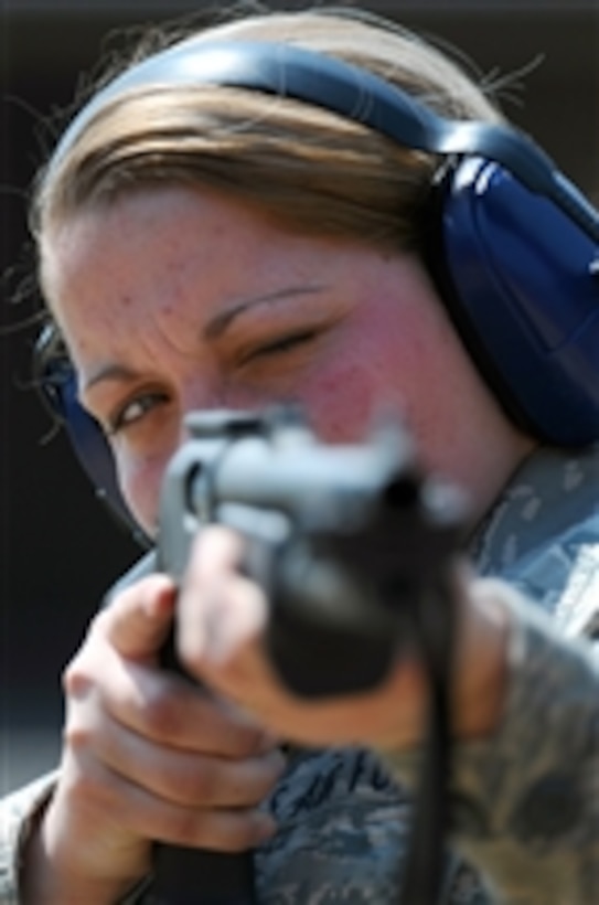 U.S. Air Force Airman 1st Class Chelsea E. Justice, with the 130th Airlift Wing Security Forces Squadron, aims an M870 shotgun during a weapons qualification range at Institute, W.Va., on April 3, 2011.  