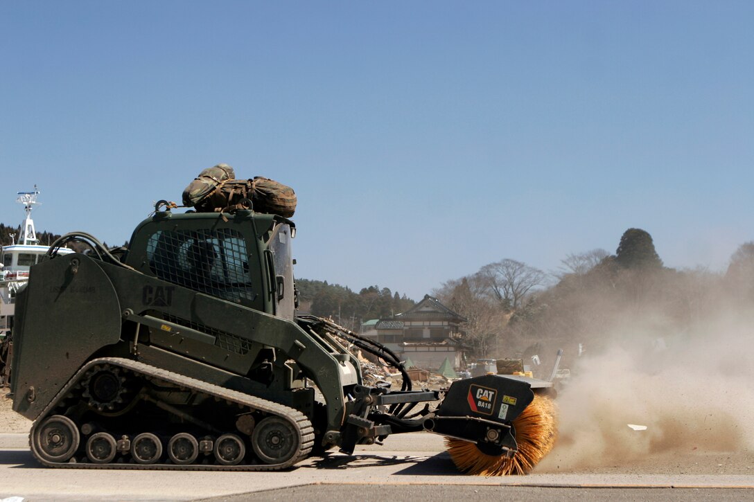 A Marine with the 31st Marine Expeditionary Unit, sweeps a street with heavy equipment, April 6. As part of Operation Tomodachi, the 31st MEU is ready to support our Japanese partners and to provide assistance when called upon.