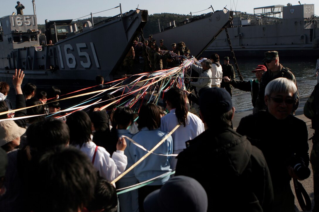 Residents of Oshima Island make a streamer of ribbons for Marines and Sailors of the 31st Marine Expeditionary Unit, as a way of thanking them for cleaning up debris, April 6. The Marines and Sailors spent about six days cleaning up debris on parts of the island during Operation Field Day.  The 31st MEU’s involvement is part of the larger Operation Tomodachi, coordinated after a 9.0 earthquake and subsequent tsunami struck Japan causing widespread damage. The 31st MEU remains ready to support its Japanese partners and to provide assistance when called upon.