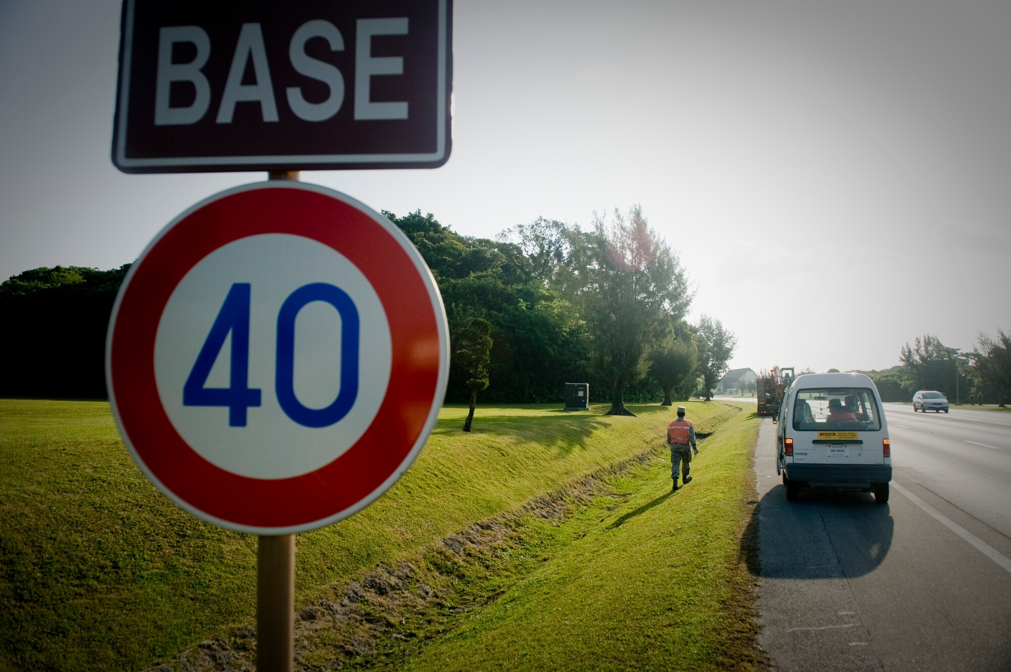 KADENA AIR BASE, Japan - Airman 1st Class James Fotakis, 353rd Aircraft Maintenance Squadron, walks down the road scanning for trash April 5. Airman Fotakis is  part of the Kadena Pride Team that helps maintain keep the base clean. (U.S. Air photo/ Staff Sgt. Jonathan Steffen)