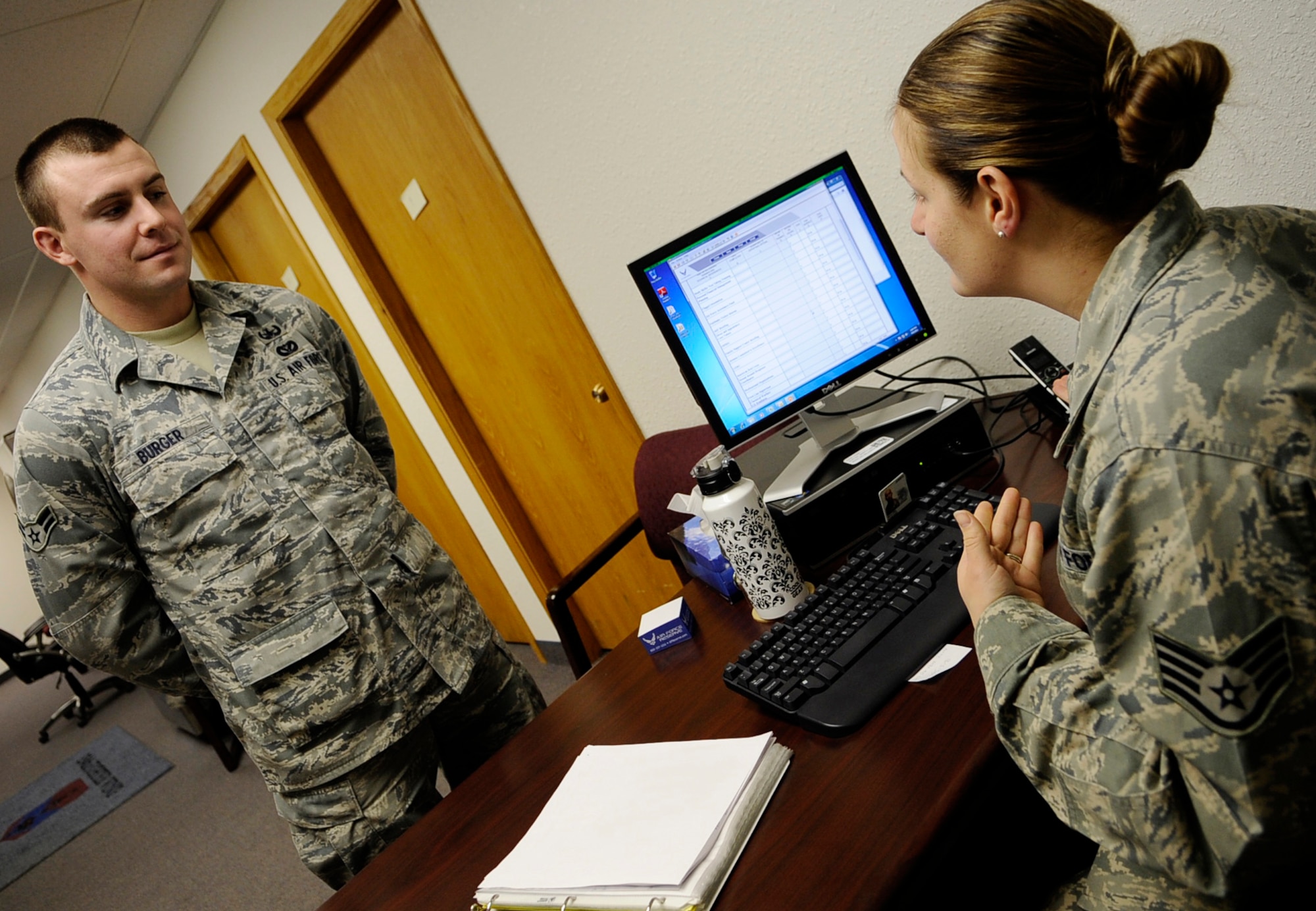 Staff Sgt. Amber Volpi answers questions about the local area for Airman 1st Class Jordan Burger April 6, 2011, Eielson Air Force Base, Alaska. The First Term Airmen Center program provides useful information about base facilities and programs to first term Airmen. Sergeant Volpi is the NCO in charge of FTAC. Airman Burger is an explosive ordinance technician assigned to the 354th Civil Engineer Squadron. (U.S. Air Force photo/Airman 1st Class Laura Goodgame) 