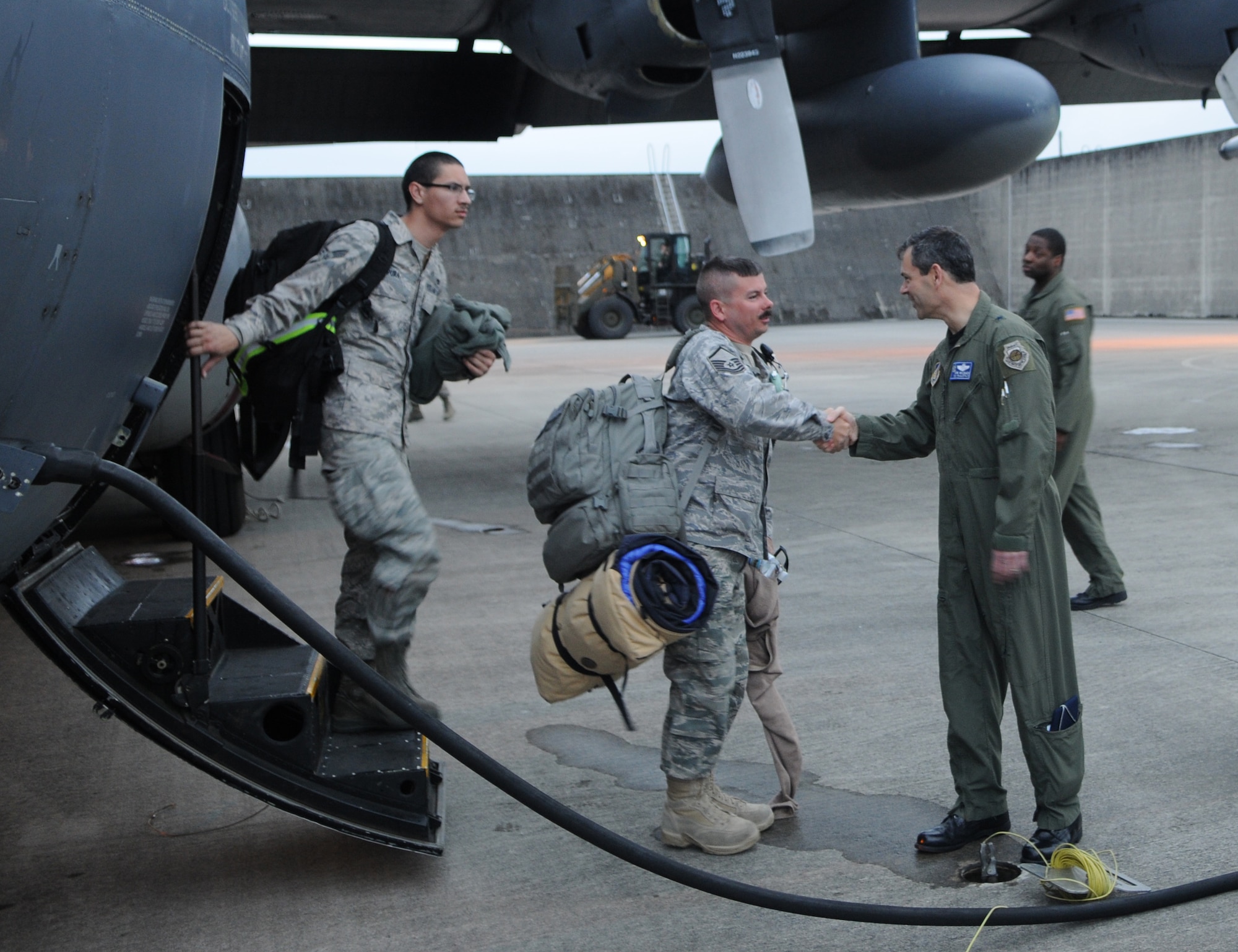 KADENA AIR BASE, Japan -- Brig. Gen. Kenneth Wilsbach, the 18th Wing Commander, welcomes home Airmen from the 353rd Special Operations Group and 718th Aircraft Maintenance Squadron here April 4. About 100 Airmen returned as Airmen repositioned here after supporting Operation Tomodachi from Yokota Air Base for nearly three weeks. (U.S. Air Force photo by Tech. Sgt. Aaron Cram)  
