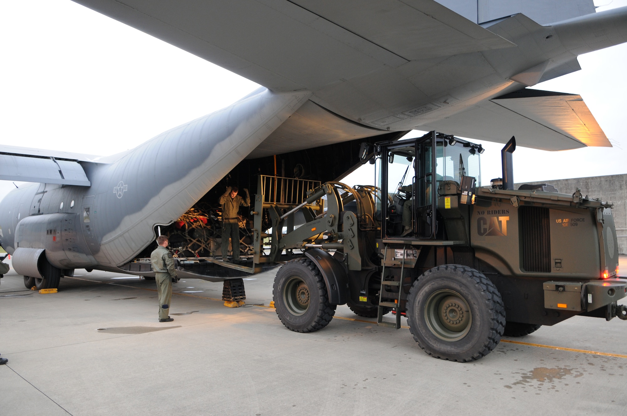 KADENA AIR BASE, Japan -- Senior Airmen Jacob Moeller, an 17th Special Operations Squadron loadmaster, guides a forklift to offload a pallet from a MC-130P Combat Shadow here April 4. About 100 Airmen from the 353rd Special Operations Group and 718th Aircraft Maintenance Squadron returned as Airmen repositioned here after supporting Operation Tomodachi from Yokota Air Base for nearly three weeks. (U.S. Air Force photo by Tech. Sgt. Aaron Cram)  