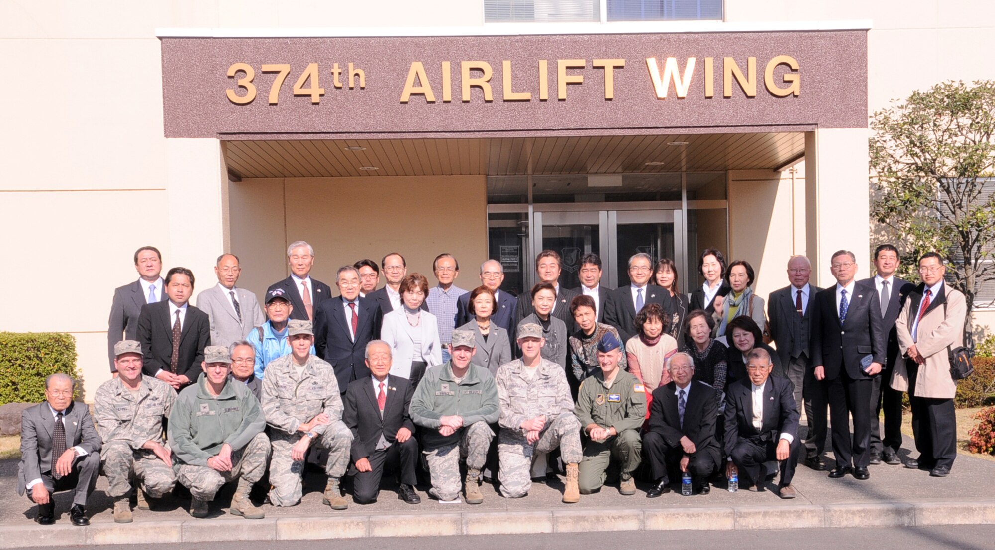 YOKOTA AIR BASE, Japan -- Senior leaders from the 374th Airlift Wing and members from several Yokota friendship clubs pose for a picture in front of the headquarters building here April 5. The friendship clubs were formed to enhance the relationships between the base and local communities as well as keep them informed of Yokota's everyday operations. (U.S. Air Force photo/Airman 1st Class Krystal M. Garrett)