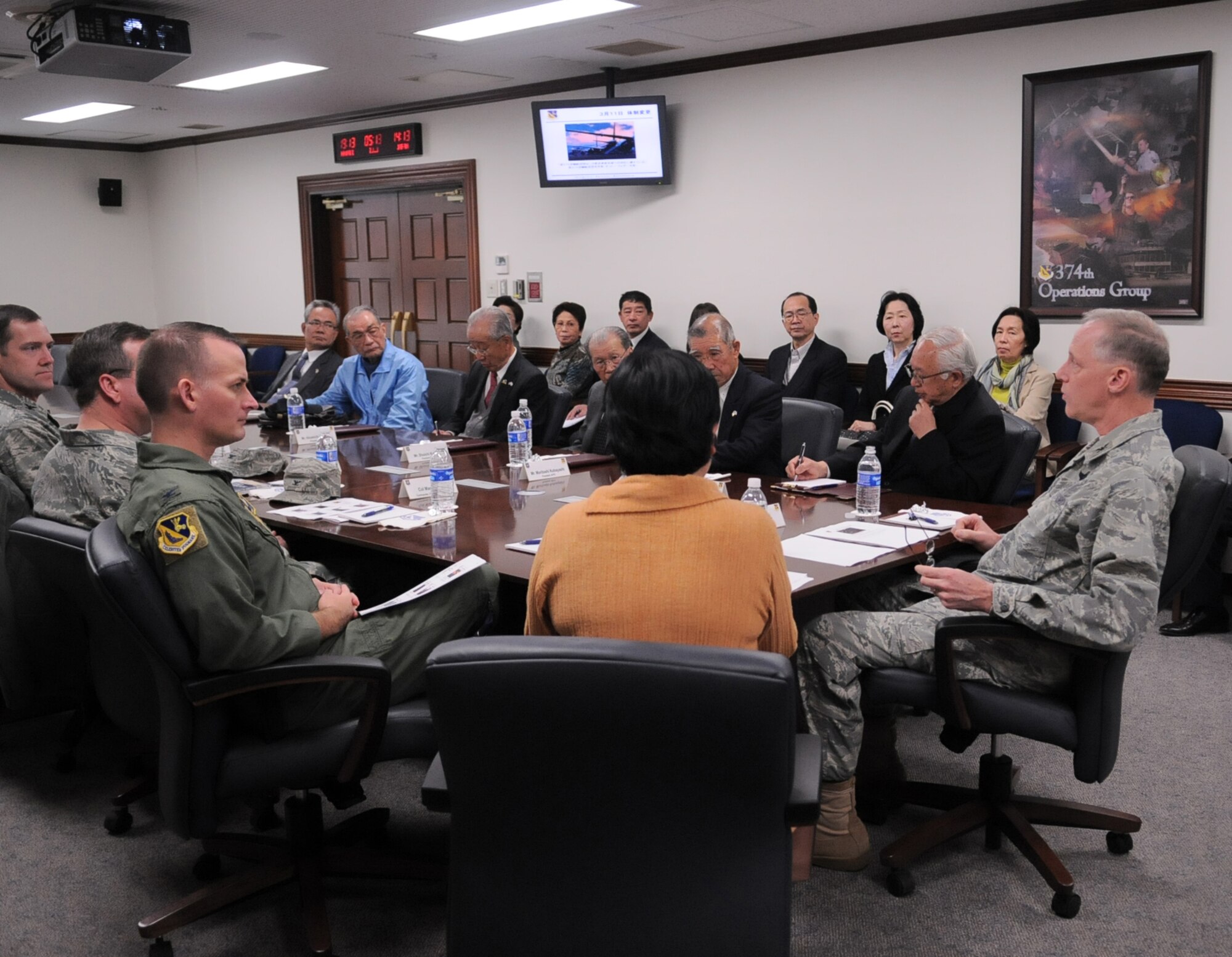 YOKOTA AIR BASE, Japan -- Col. Otto Feather, 374th Airlift Wing commander, briefs members of several Yokota friendship clubs on operations during Operation Tomodachi April 5, 2011. The friendship clubs were formed to enhance the relationship between the base and local communities as well as keep them informed of Yokota's everyday operations. (U.S. Air Force photo/Airman 1st Class Krystal M. Garrett)