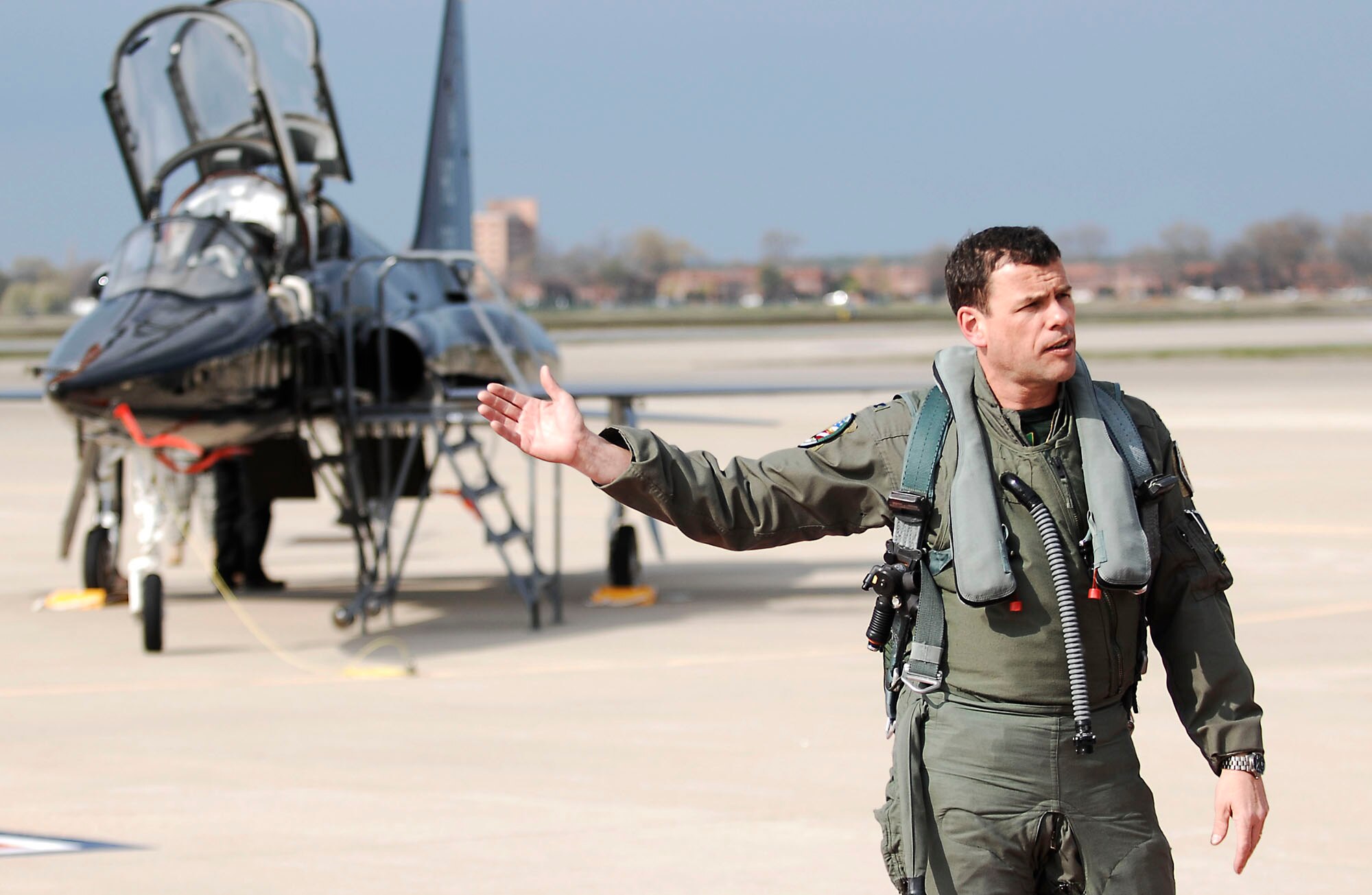 Col. Matthew Molloy presents a T-38 Talon April 1, 2011, at Langley Air Force Base, Va. The T-38, from Holloman AFB, N.M., is here for six months to help train F-22 Raptor pilots. Colonel Molloy is the 1st FW commander. (U.S. Air Force photo/Airman 1st Class Kayla Newman) 