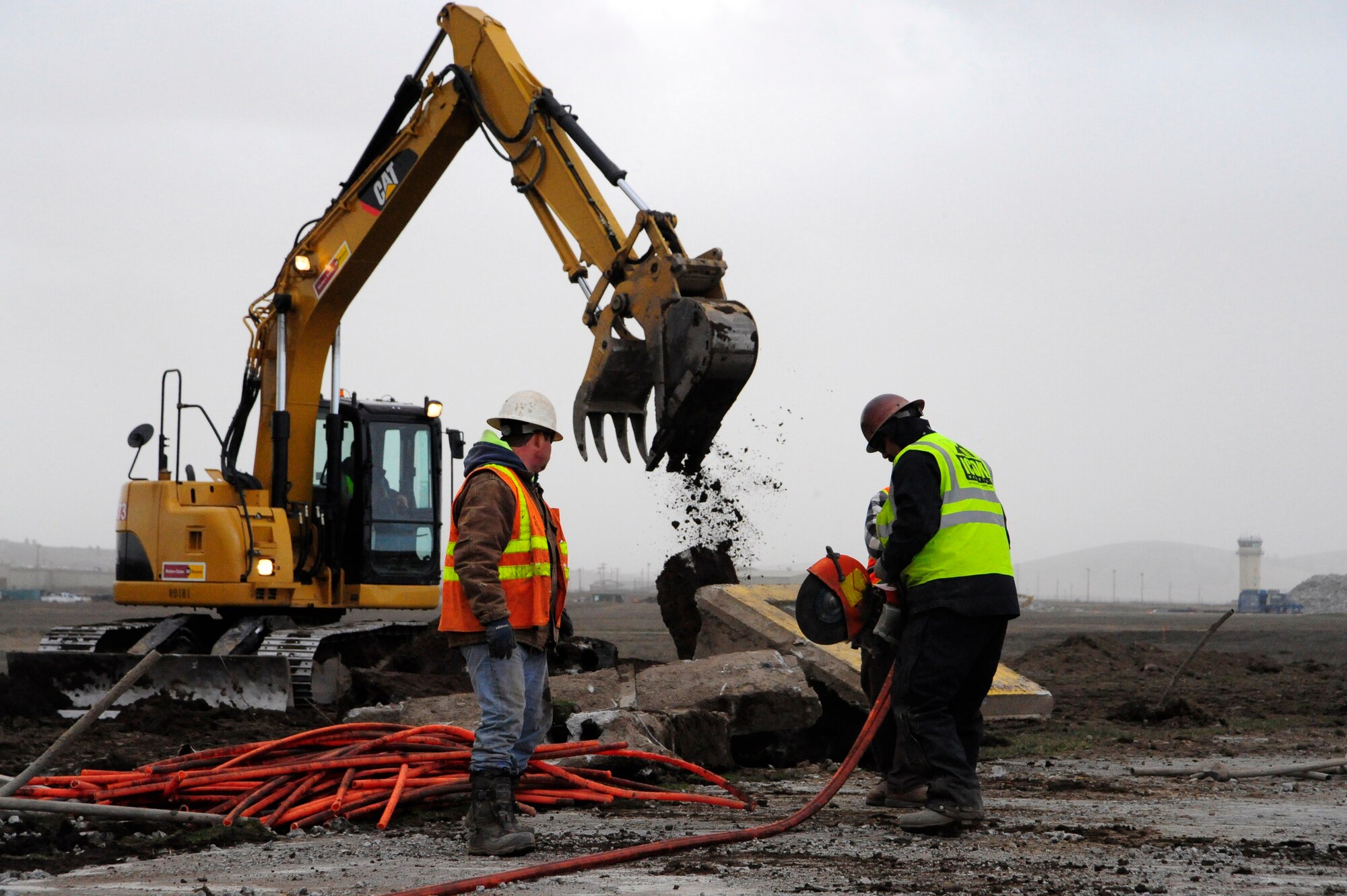 Contractors demolish the existing electrical duct banks and cut electrical conduits out on the Fairchild runway March 31. The Fairchild runway has been under construction since late February. (U.S. Air Force photo/Airman 1st Class Taylor Curry)