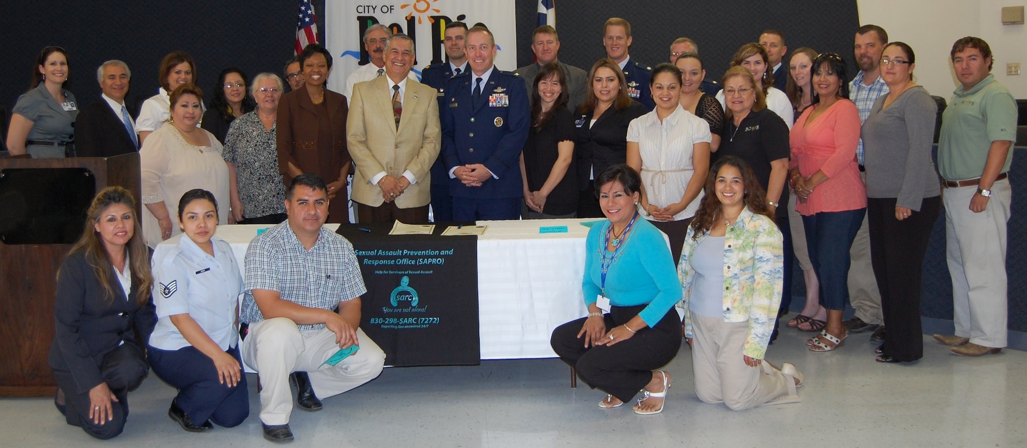 LAUGHLIN AIR FORCE BASE, Texas - - Local supporters of Sexual Assault Awareness Month met on April 4 as Col. Michael Frankel, 47th Flying Training Wing commander, and Roberto Fernandez, Del Rio mayor, signed the SAAM proclamation at Del Rio’s City Hall. (U.S. Air Force photo by 2nd Lt. Angela Martin)
