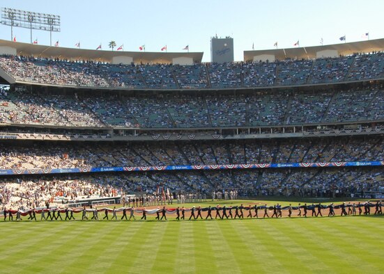 Edwards sent 16 Airmen to participate in opening day festivities at Dodger Stadium March 31. They teamed up with approximately 120 additional members from sister services as well as the Los Angeles Police Department and Los Angeles Fire Department, to unfurl a giant American Flag during the National Anthem. (Air Force photo by Laura Mowry)