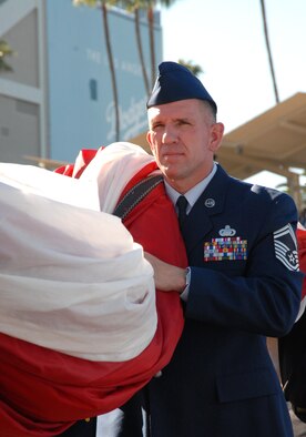 Chief Master Sgt. Donald Rupp, 95th Force Support Squadron superintendent, stands just outside Dodger Stadium, patiently waiting for the pre-game ceremonies to begin on Opening Day, March 31. Chief Rupp, the senior ranking military representative from Edwards, accompanied 15 Airmen to the event where they teamed with other service, police and fire department members to unfurl a giant American flag across the stadium outfield during the singing of the National Anthem. (Air Force photo by Laura Mowry)