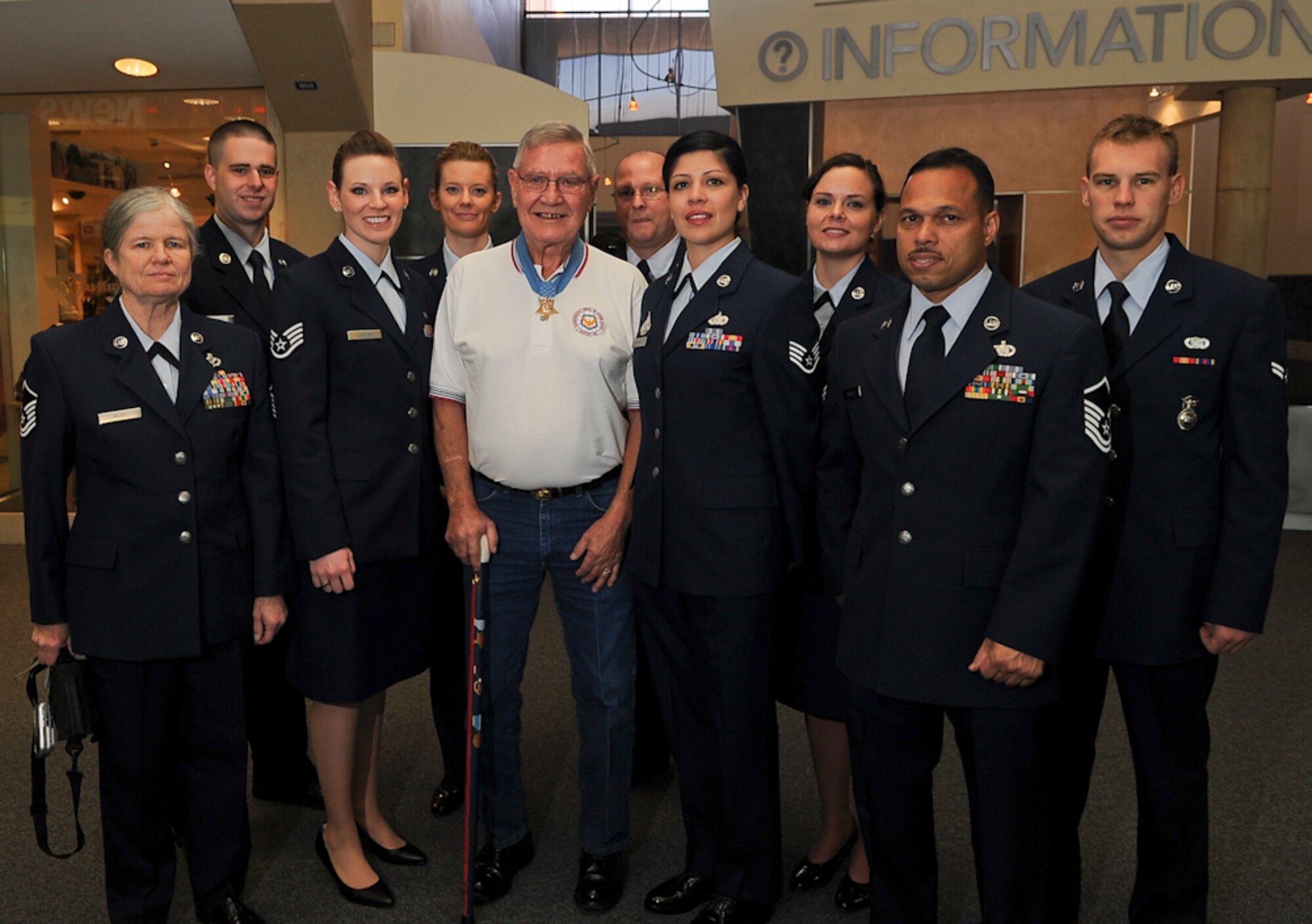 Medal of Honor recipient Retired Cpl. Duane E. Dewey, USMC, Korean War, poses with the members of the 136th Airlift Wing, Texas Air National Guard at DFW Airport where eight MOH recipients and one representative for the Late John Finn, WWII MOH  arrived April 5, 2011 for the annual Gainesville MOH Parade. The parade will be held April 9, honoring our Nation's highest decorated military heroes. (U.S. Air Force photo by Senior Master Sgt. Elizabeth Gilbert/released)