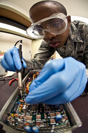 NELLIS AIR FORCE BASE, Nev.--  Senior Airman Mathew Harrington, a Precision Measurement Equipment Laboratory journeyman assigned to the 57th Maintenance Squadron, conducts maintenance on a 53 plug-in unit, which is used to calibrate an oscilloscope April 5. An oscilloscope is a electronic instrument used for measuring electronic sound waves.(U.S. Air Force photo by Airman 1st Class Matthew Lancaster)


