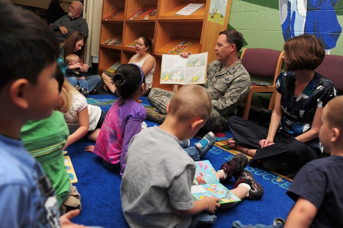 NELLIS AIR FORCE BASE, Nev. --   Col. Steven Garland, 99th Air Base Wing commander, and his wife Paula Garland read books to military family members at the base library to support National Child Abuse Prevention Month, April 6, 2011. National Child Abuse Prevention Month is a proclamation announced each April by the President of the United States to encourage public awareness of child abuse and neglect, recommit State resources to the cause and promote community involvement through State and local activities.   (U.S. Air Force photo by Staff Sgt. William P.Coleman)  