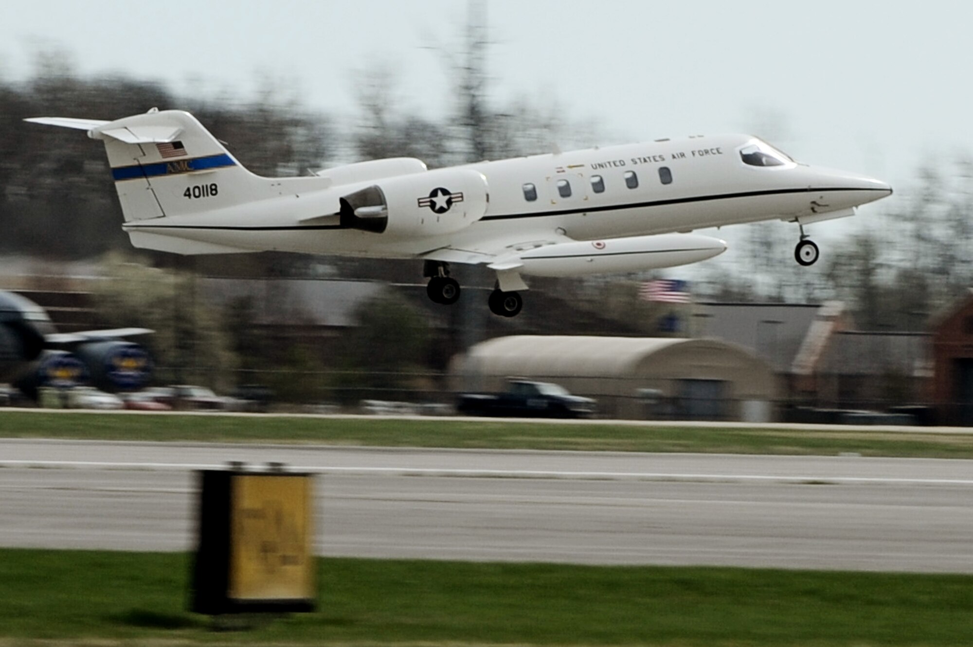 A C-21A takes-off April 6, 2011 at Scott Air Force Base, Ill. The C-21 was flown during the initial qualification course under the 458th AS after it regained the C-21 training mission from the 45th AS at Kessler AFB, Miss. The C-21 training mission belonged to Scott until the early 1990s. (U.S. Air Force Photo/Staff Sgt. Brian J. Valencia)