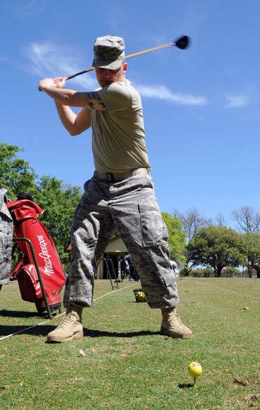 Airman 1st Class Nick Kaddatz, 2nd Operations Support Squadron, catches up on his golf swing during his lunch break on the driving range at the Fox Run Golf Course at Barksdale Air Force Base, La., April 6. (U.S. Air Force photo/Senior Airman Alexandra M. Boutte) (RELEASED)
