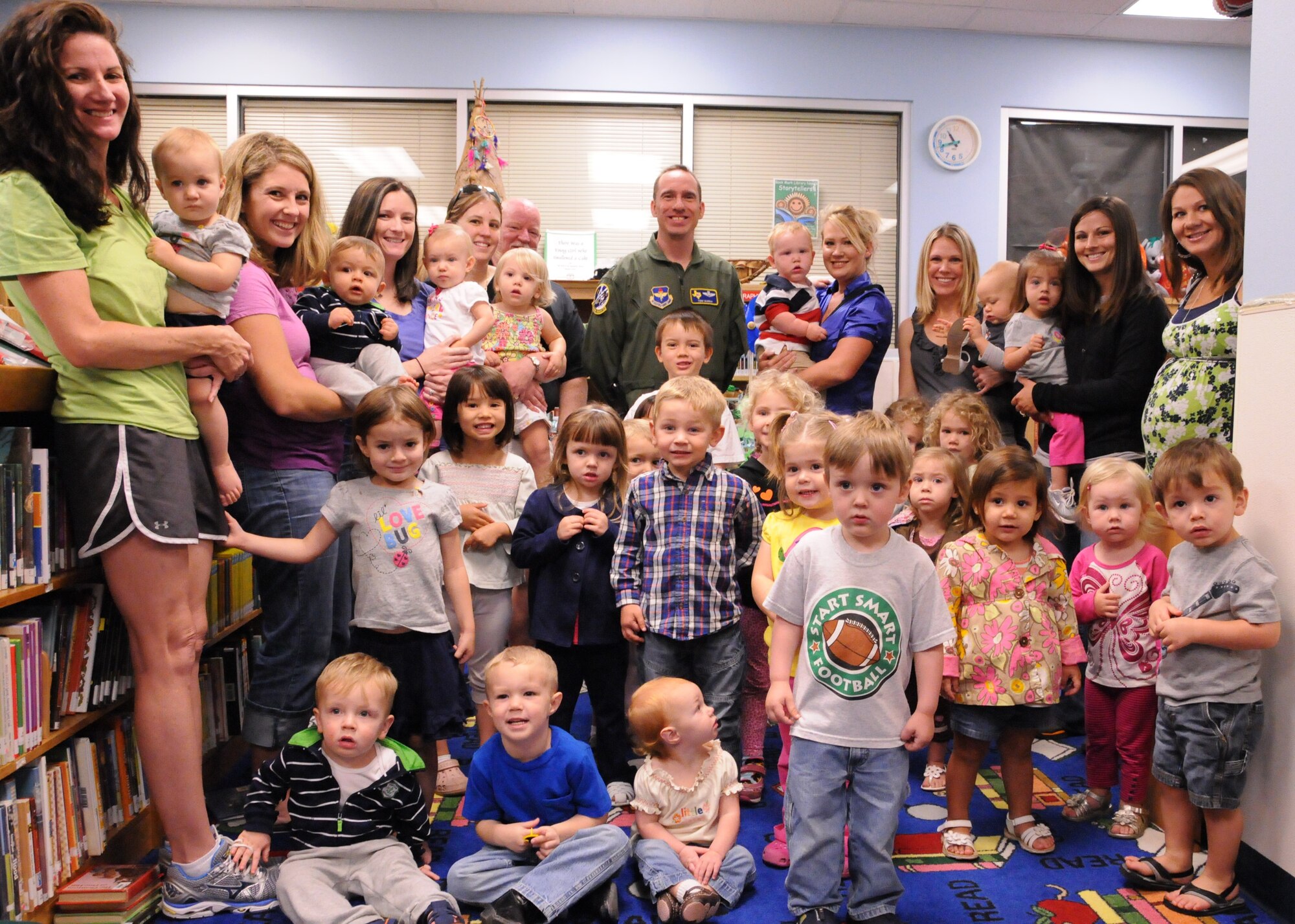 LAUGHLIN AIR FORCE, Texas – Colonel Thomas Murphy, 47th Flying Training Wing vice commander, poses with several Laughlin youth and their mothers after signing a proclamation declaring April as Child Abuse Prevention Month at Laughlin. (U.S. Air Force photo by Airman 1st Class Blake Mize)