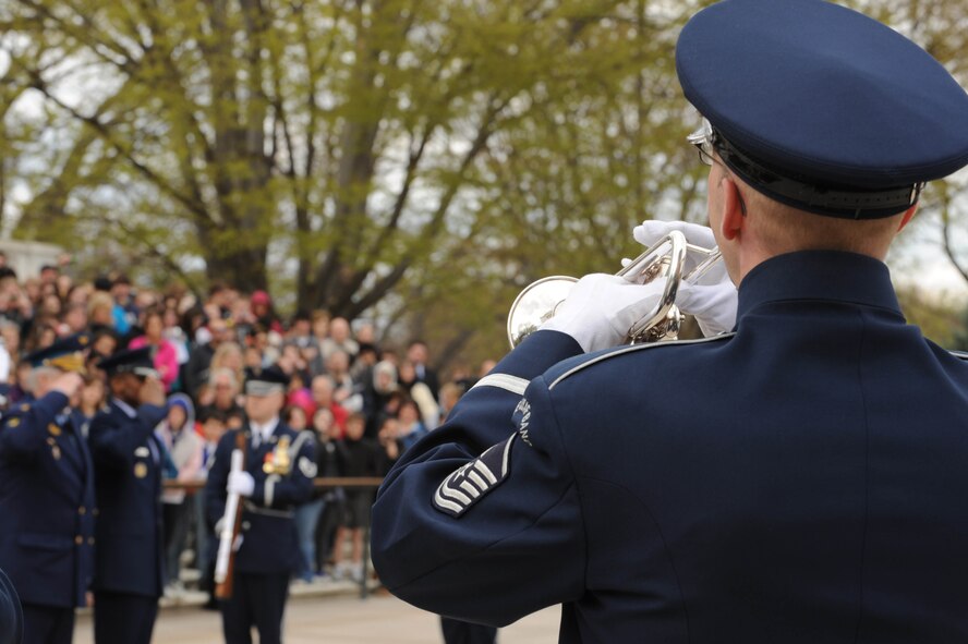 Master Sgt. Michael Bosch, member in the U.S. Air Force band, plays Taps for the wreath laying ceremony at The Tomb of The Unknown Soldier, April 5, at Arlington National cemetery, Arlington VA. The guest honoree who presented the wreath was Gen. Col. Alexander Nikolyevich Zelin, Commander-in-Chief of the Russian Air Force in honor of all fallen service members. (U.S. Air Force photo by Senior Airman Christopher Ruano)