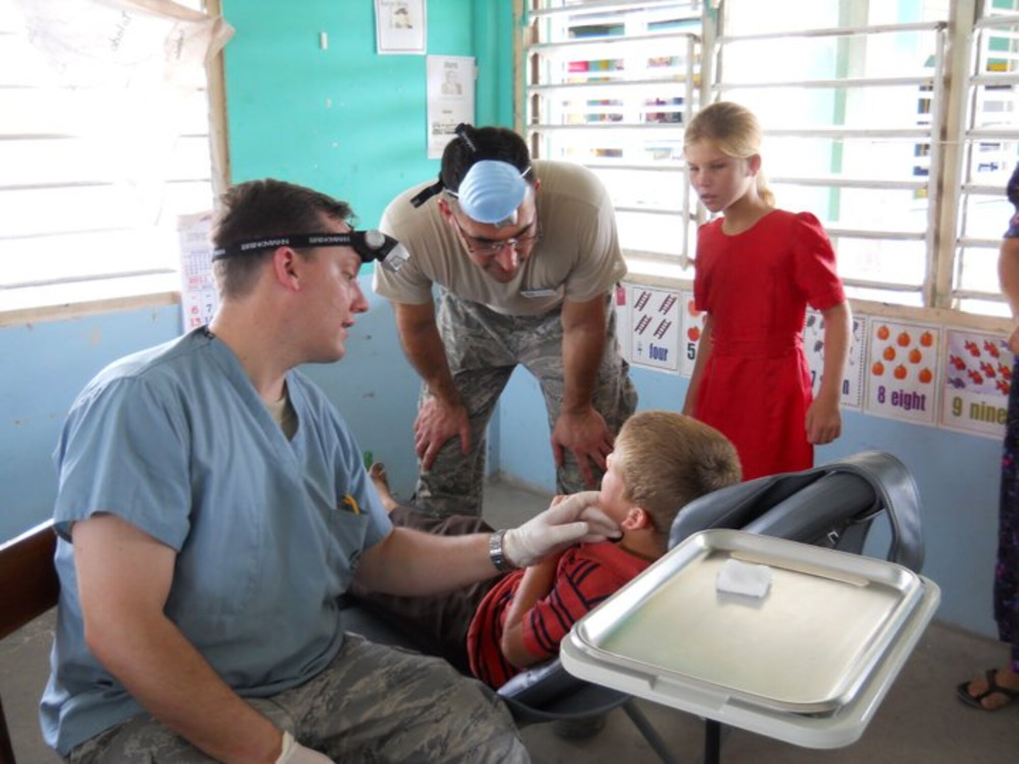 Major Vincent Chiappone and Major Michael Daily, dentists with the 940th Aerospace Medicine Squadron, Beale Air Force Base, Calif., see patients at a clinic in a remote village in Belize, Apr 1.  The two Reservists are members of a 42-person team of U.S. Air Force medical professionals who are in Belize for the 2011 Medical Readiness Training Exercise.  The annual exercise brings humanitarian care and free medical assistance to citizens of the host country. (Courtesy Photo)
