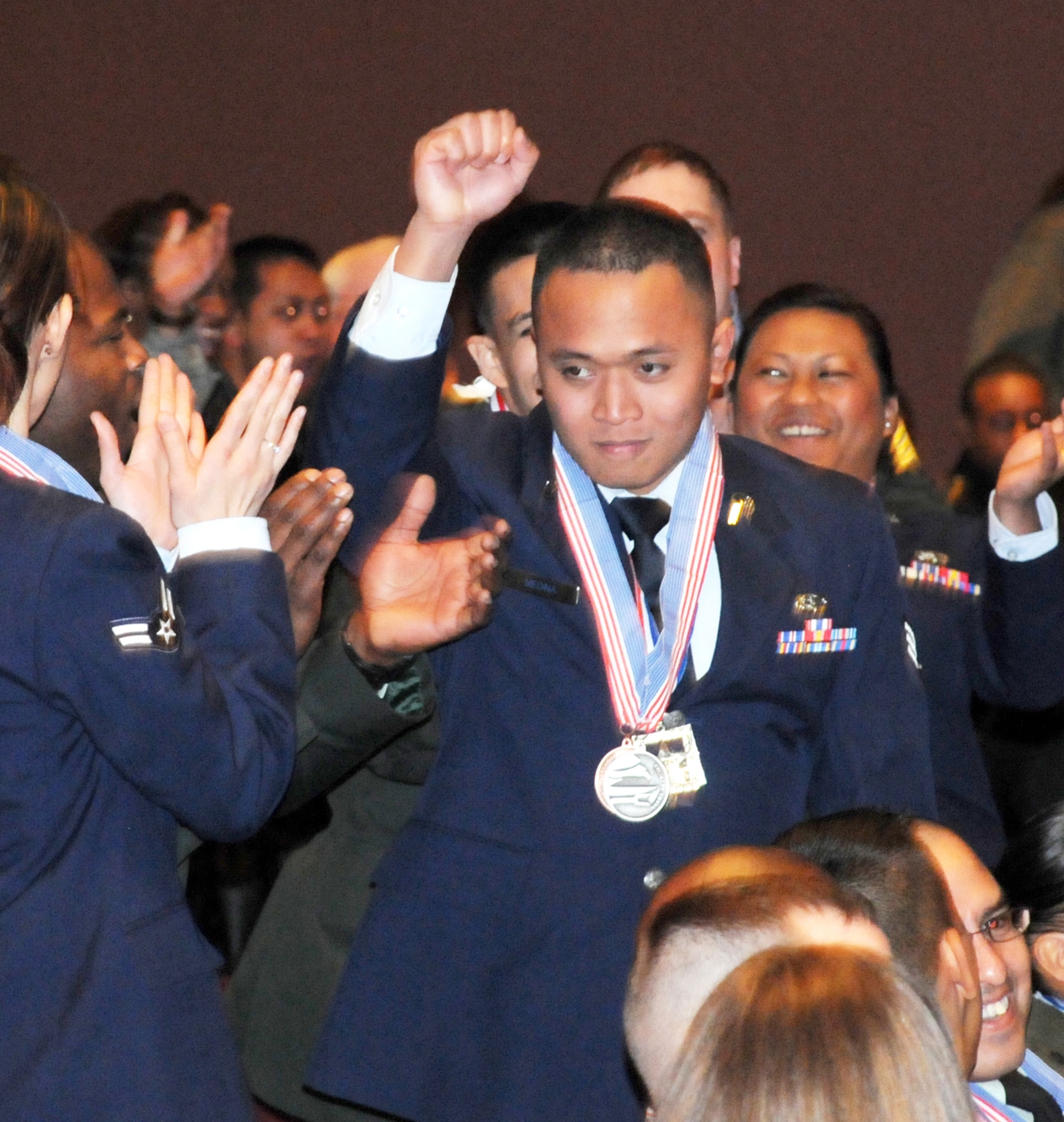 Senior Airman Ghil Medina celebrates after being named Junior Chef of the Year March 11, 2011, at the 36th Annual Culinary Arts Competition awards ceremony at Fort Lee, Va. Airman Medina is the first Airman to win the title, which is traditionally held by the Army. The annual culinary competition showcases the talents of U.S. Armed Forces food specialists worldwide. Airman Medina is assigned to Joint Base Langley-Eustis, Va. (Courtesy photo)