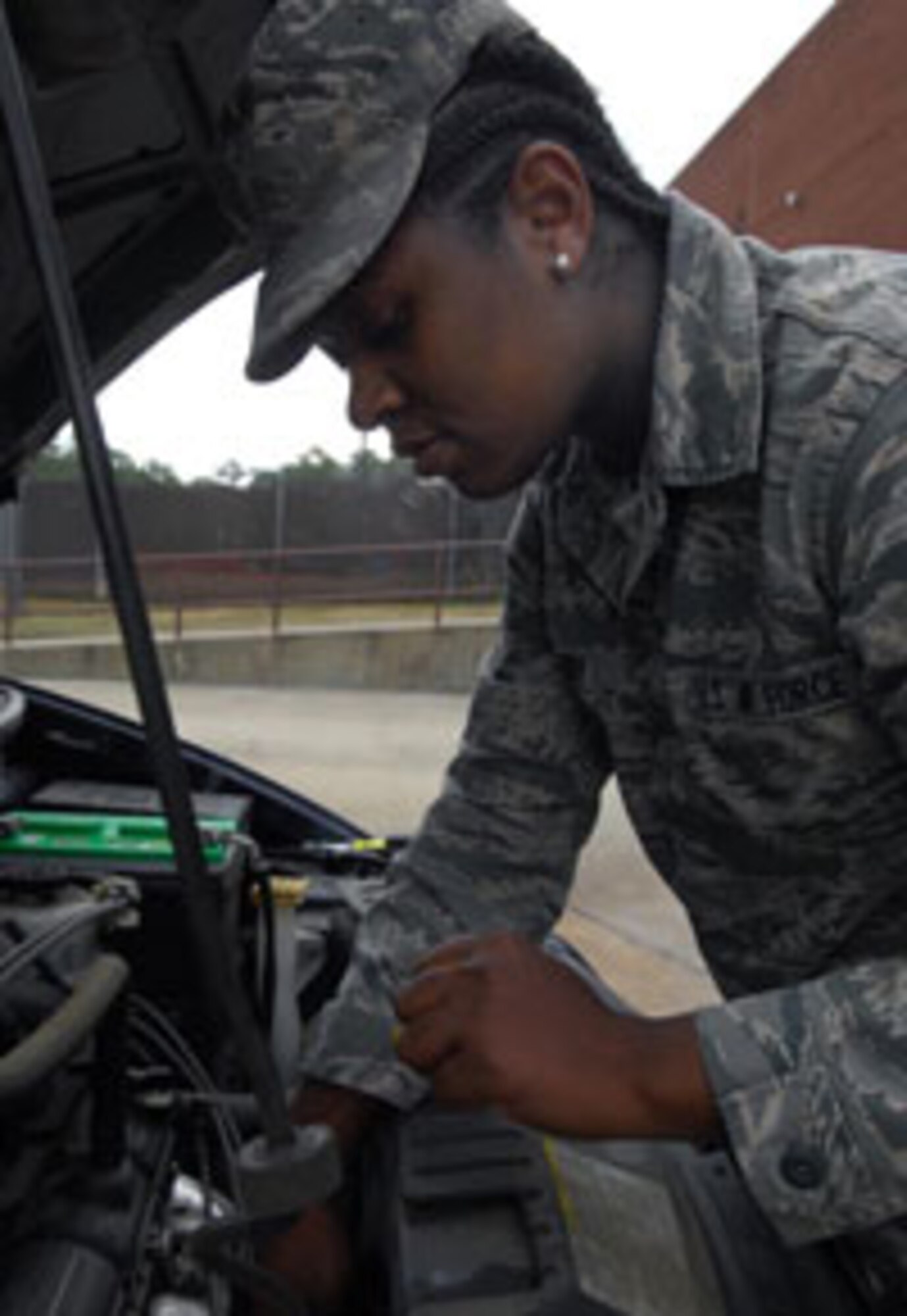 Senior Airman Vrajhi Brisby, 43rd Logistic Readiness Squadron vehicle operator performs routine vehicle checks on a government owned vehicle. Brisby recently returned from a deployment to an undisclosed location in Southwest Asia, where she worked as a convoy driver. 

