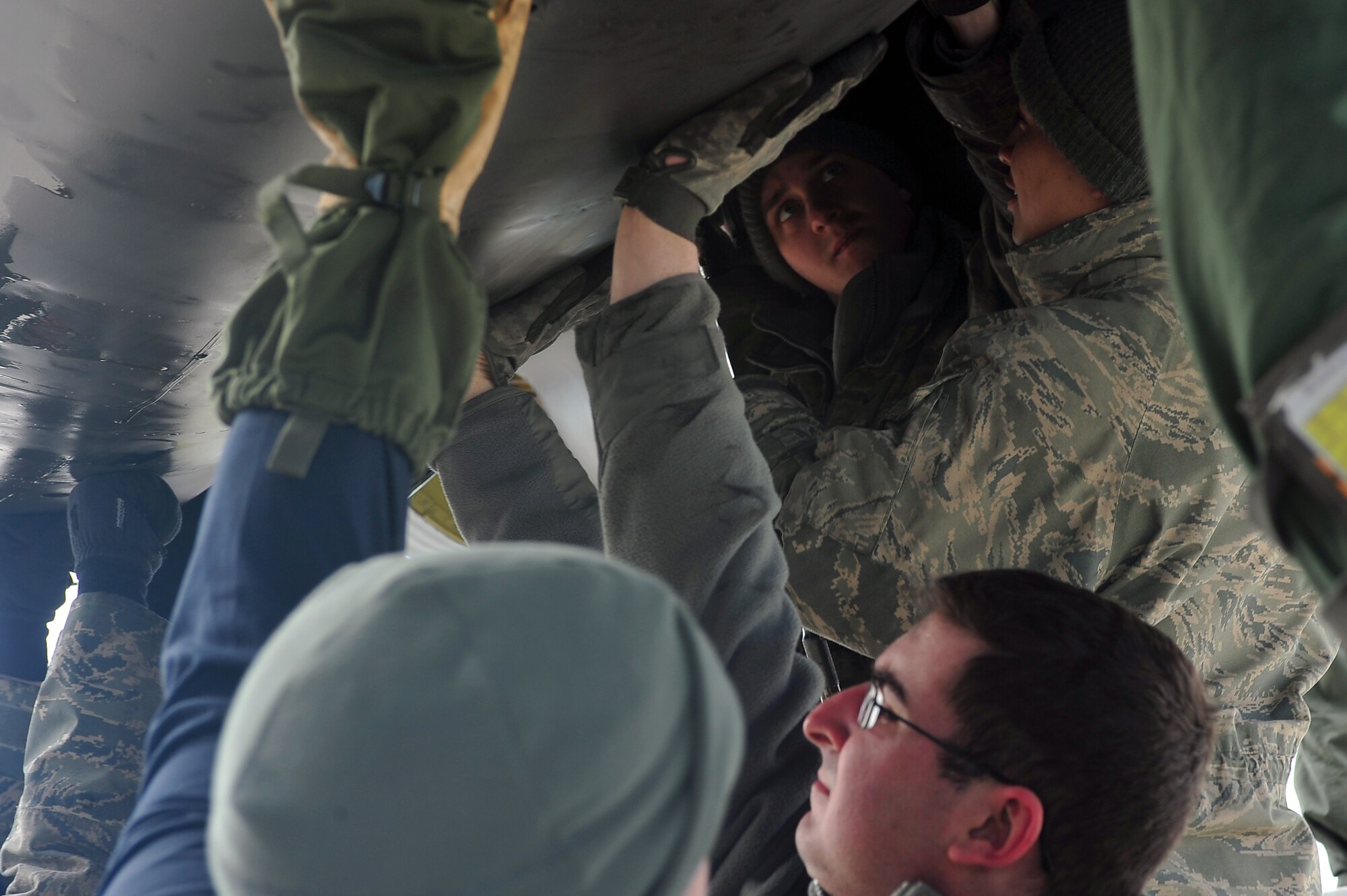 MINOT AIR FORCE BASE, N.D. – Members of the 5th Aircraft Maintenance Squadron remove the engine casing of a B-52H Stratofortress here April 2. The Airmen of Team Minot perform this kind of maintenance daily to keep Minot AFB’s bomber fleet ready to defend this country’s freedom at a moment’s notice. (U.S. Air Force photo/Senior Airman Jesse Lopez) 