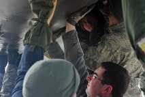 MINOT AIR FORCE BASE, N.D. – Members of the 5th Aircraft Maintenance Squadron remove the engine casing of a B-52H Stratofortress here April 2. The Airmen of Team Minot perform this kind of maintenance daily to keep Minot AFB’s bomber fleet ready to defend this country’s freedom at a moment’s notice. (U.S. Air Force photo/Senior Airman Jesse Lopez) 
