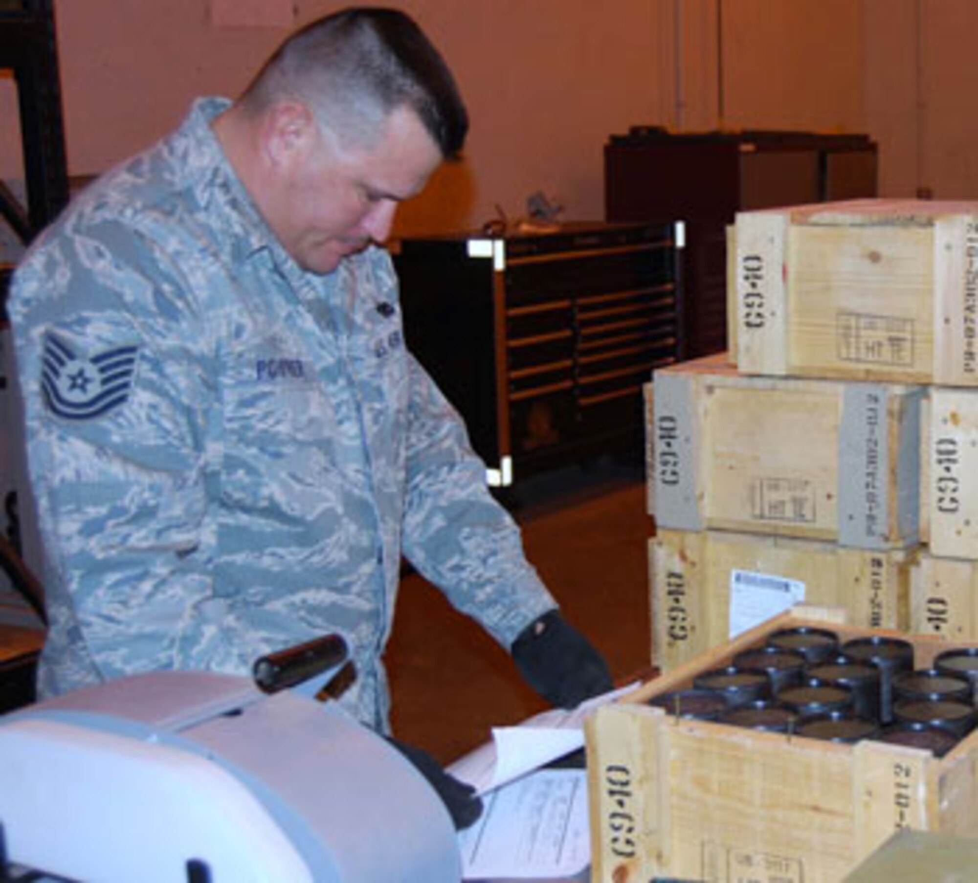 Tech. Sgt. James Poirrier, 43rd Logistics Readiness Squadron, checks out some munitions while deployed to Iraq.

