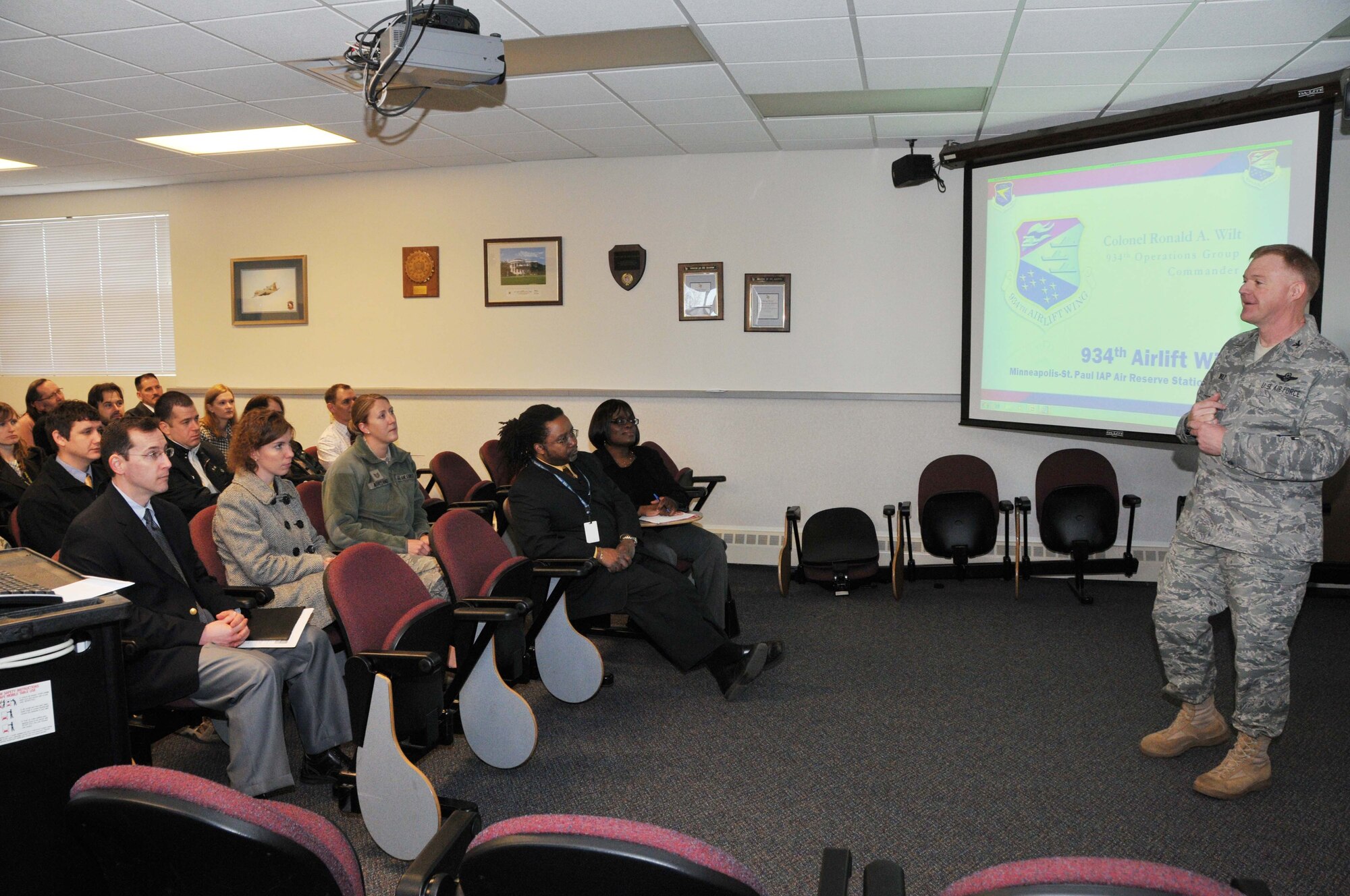 Col. Ron Wilt, 934th Operations Group commander, talks about the 934th Airlift Wing mission with members of the Federal Outreach Leadership Development tour April 5.  (Air Force Photo/Paul Zadach)