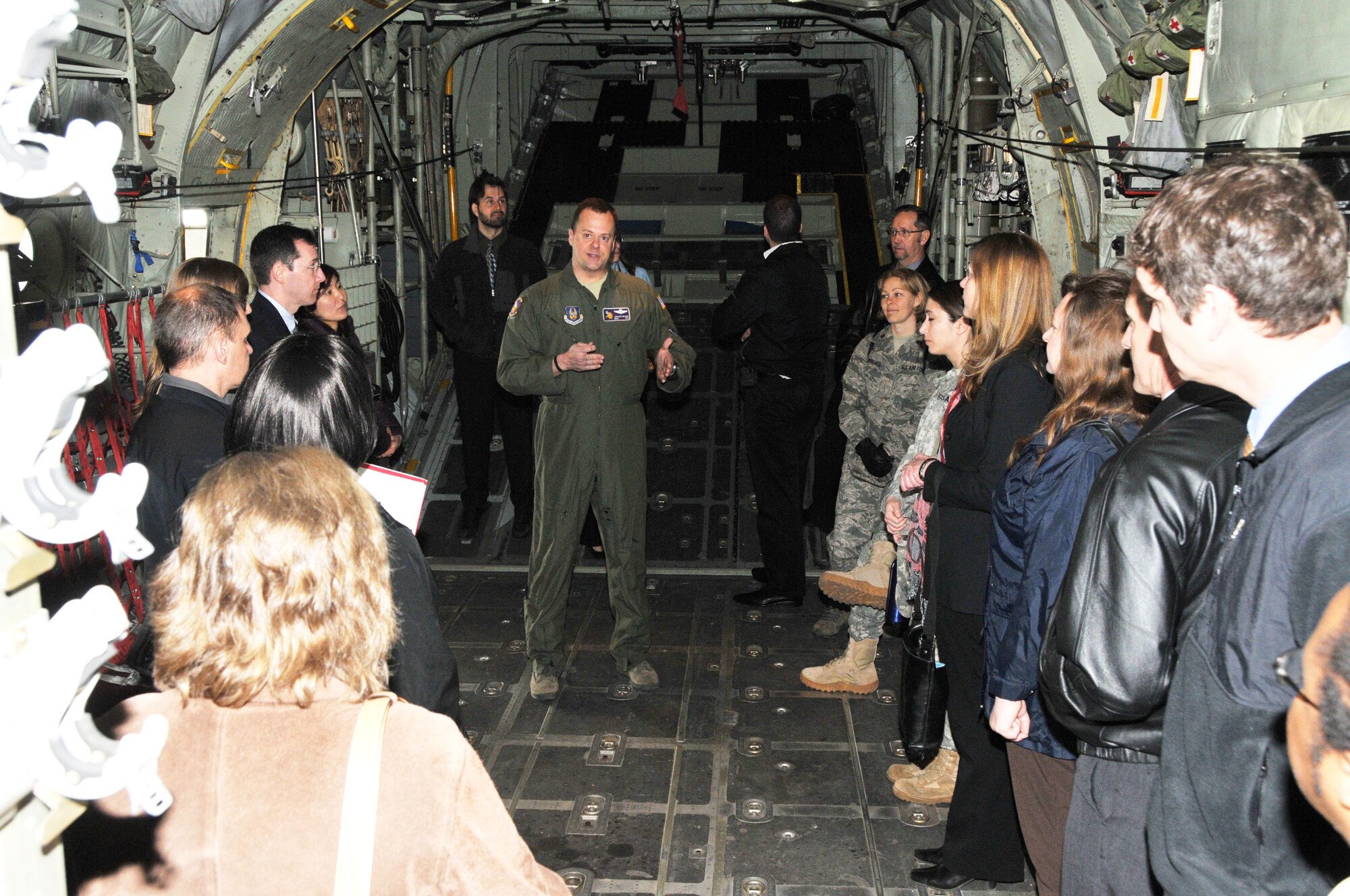 Chief Master Sgt. John Grutzmacher, 96th Airlift Squadron chief loadmaster, shows the inside of a 934th Airlift Wing C-130 aircraft to members of the Federal Outreach Leadership Development tour April 5.  (Air Force Photo/Paul Zadach)