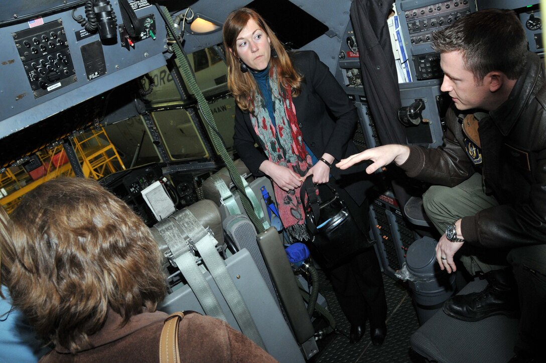 Capt. Joel Loomis, 96th Airlift Squadron pilot, shows the cockpit a 934th Airlift Wing C-130 aircraft to members of the Federal Outreach Leadership Development tour April 5.  (Air Force Photo/Paul Zadach)