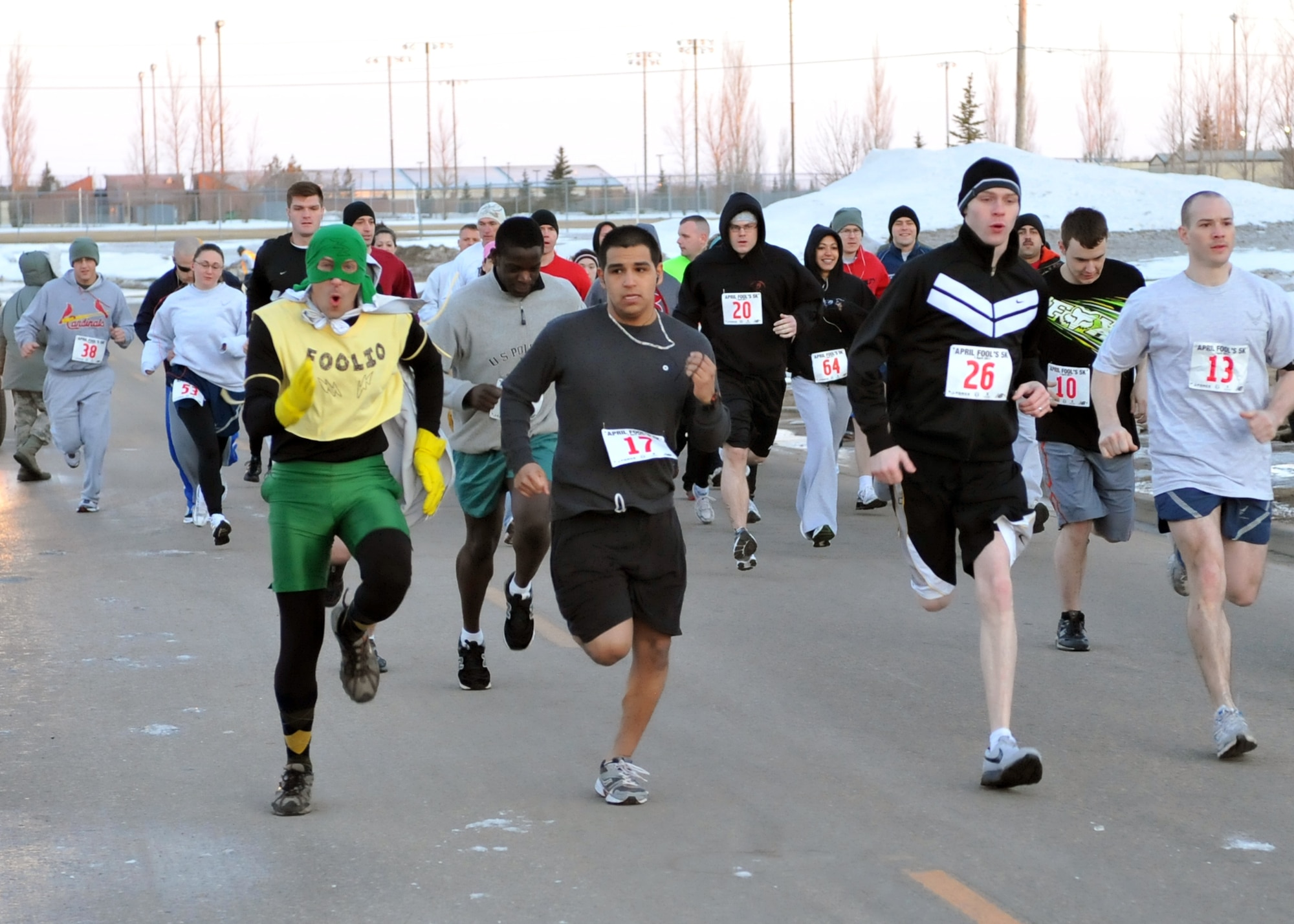 MINOT AIR FORCE BASE, N.D. -- Tech. Sgt. Thomas “Foolio” Dow, 5th Bomb Wing Public Affairs community relations non-commissioned officer in charge, participates in the April Fool’s Day 5K fun run, here April 1. This annual event is open to all of Team Minot and is one of the ways the base helps to promote fitness among its Airmen.  (U.S. Air Force photo/Staff Sgt. Keith Ballard)