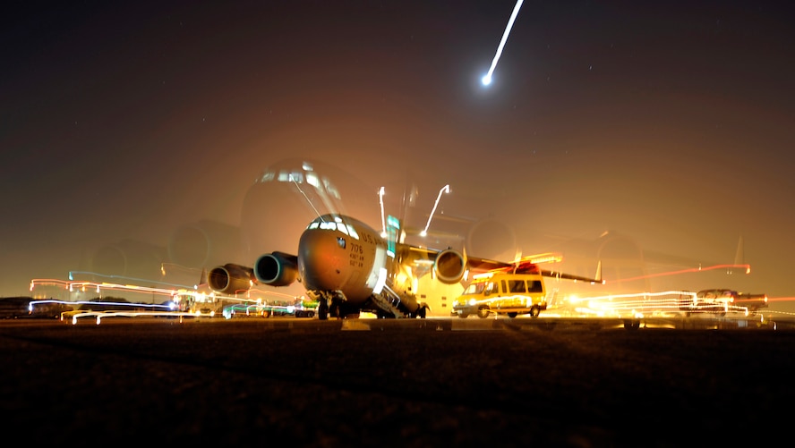 A C-17 Globemaster III from Dover Air Force Base, Del., is loaded with cargo by Airmen from the 621st Contingency Response Wing at Galeao Air Base, Rio de Janeiro, Brazil, March 19, 2011, in support of President Obama's visit to Latin America March 19-23. Thirty-five Airmen tasked for the contingency response team expanded capability at airfields in Brazilia and Rio de Janeiro, Brazil, Santiago, Chile and San Salvador, El Salvador in support of air mobility requirements for presidential personnel and cargo.(U.S. Air Force Photo/Tech. Sgt. Laura K. Deckman) 