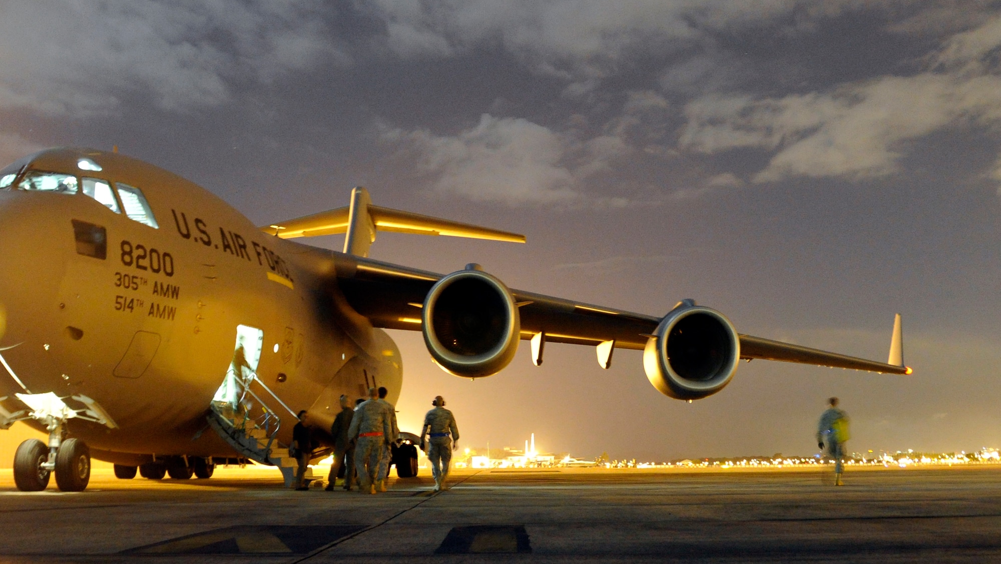 Members of the 621st Contingency Response Wing from Joint Base McGuire-Dix-Lakehurst, N.J., respond to offload a C-17 Globemaster III at Galeao Air Base, Rio de Janeiro, Brazil in support of President Obama's visit to Latin America March 19-23. Thirty-five Airmen tasked for the contingency response team expanded capability at airfields in Brasilia and Rio de Janeiro, Brazil, Santiago, Chile and San Salvador, El Salvador in support of air mobility requirements for presidential personnel and cargo.(U.S. Air Force photo by Tech. Sgt. Laura K. Deckman/released)
