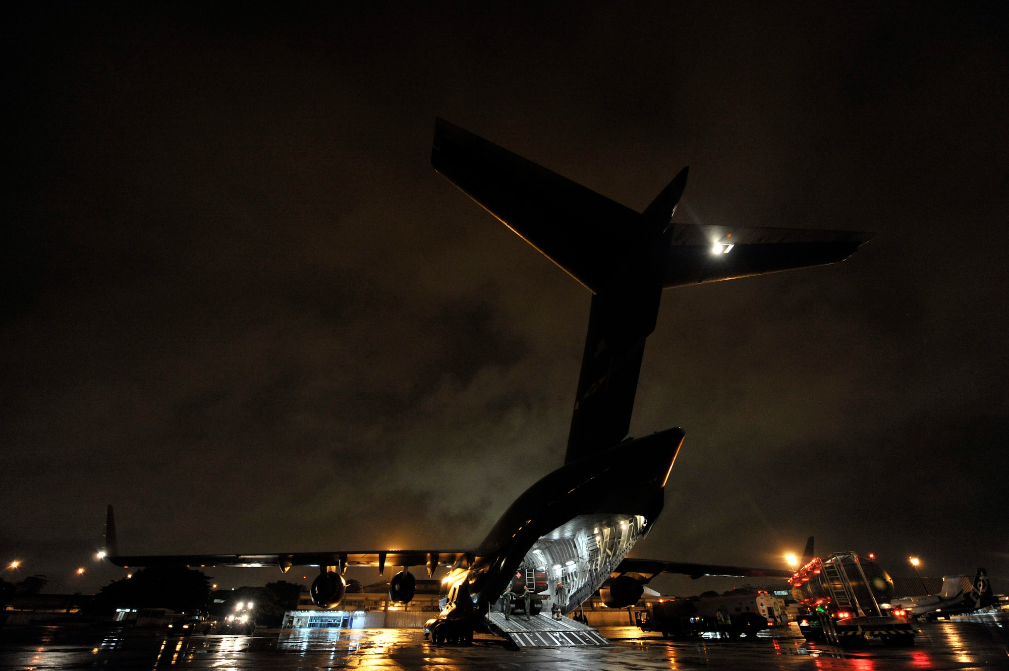 Members of the 621st Contingency Response Wing from Joint Base McGuire-Dix-Lakehurst, N.J., conduct aircraft offload operations at Galeao Air Base, Rio de Janeiro, Brazil in support of President Obama's visit to Latin America March 19-23. Thirty-five Airmen tasked for the contingency response team expanded capability at airfields in Brasilia and Rio de Janeiro, Brazil, Santiago, Chile and San Salvador, El Salvador in support of air mobility requirements for presidential personnel and cargo.(U.S. Air Force photo by Tech. Sgt. Laura K. Deckman/released)